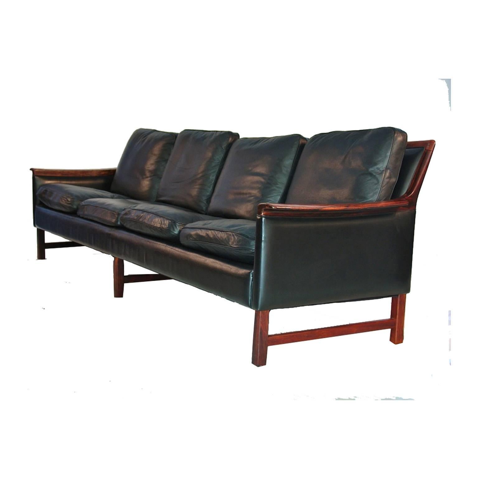 High quality and elegant rosewood and black leather Torbjørn Afdal 
