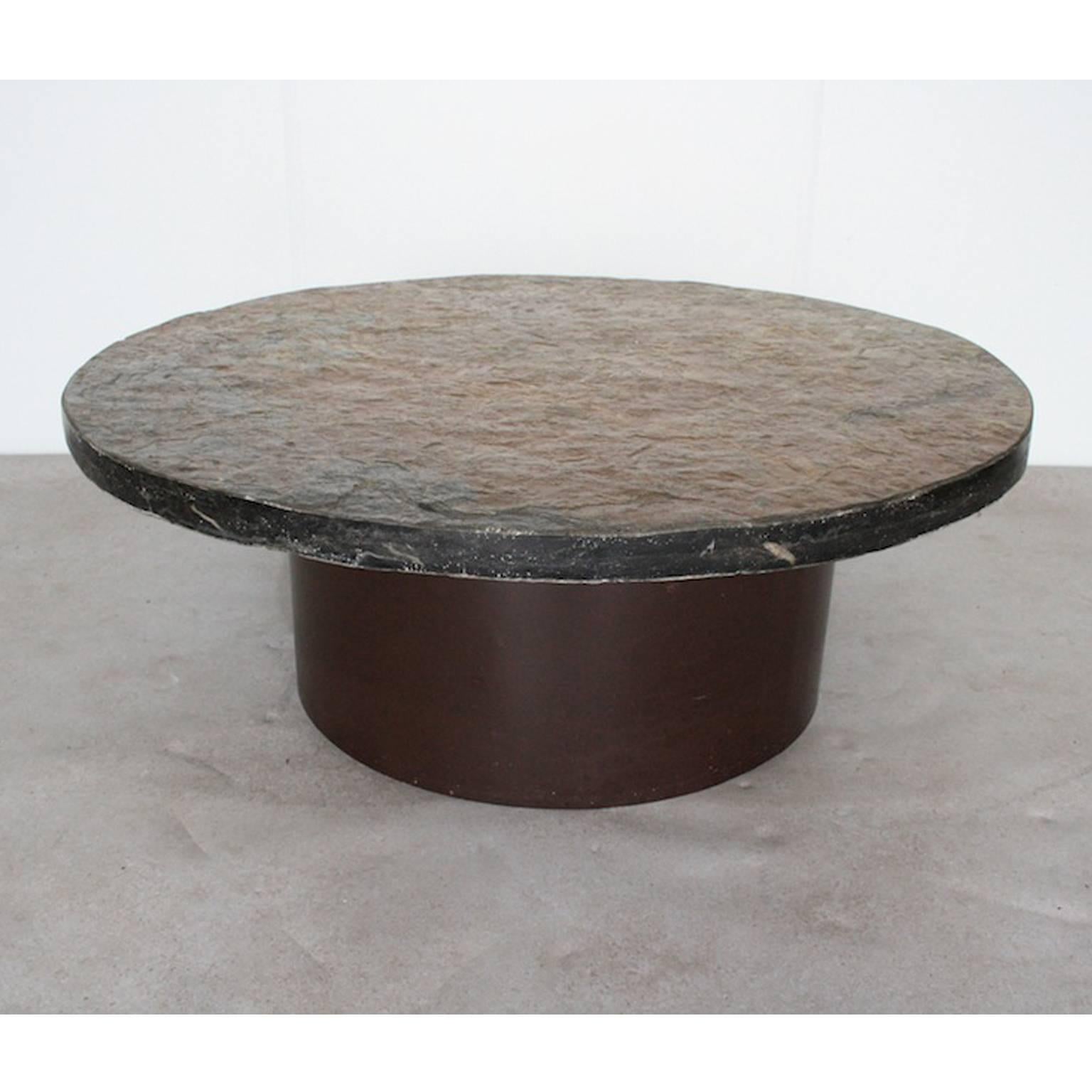 Heavy stone coffee table in the style of Paul Kingma

330 mm thick stone top and brown round metal foot.

Measures: Diameter 102 cm
Height 38 cm.