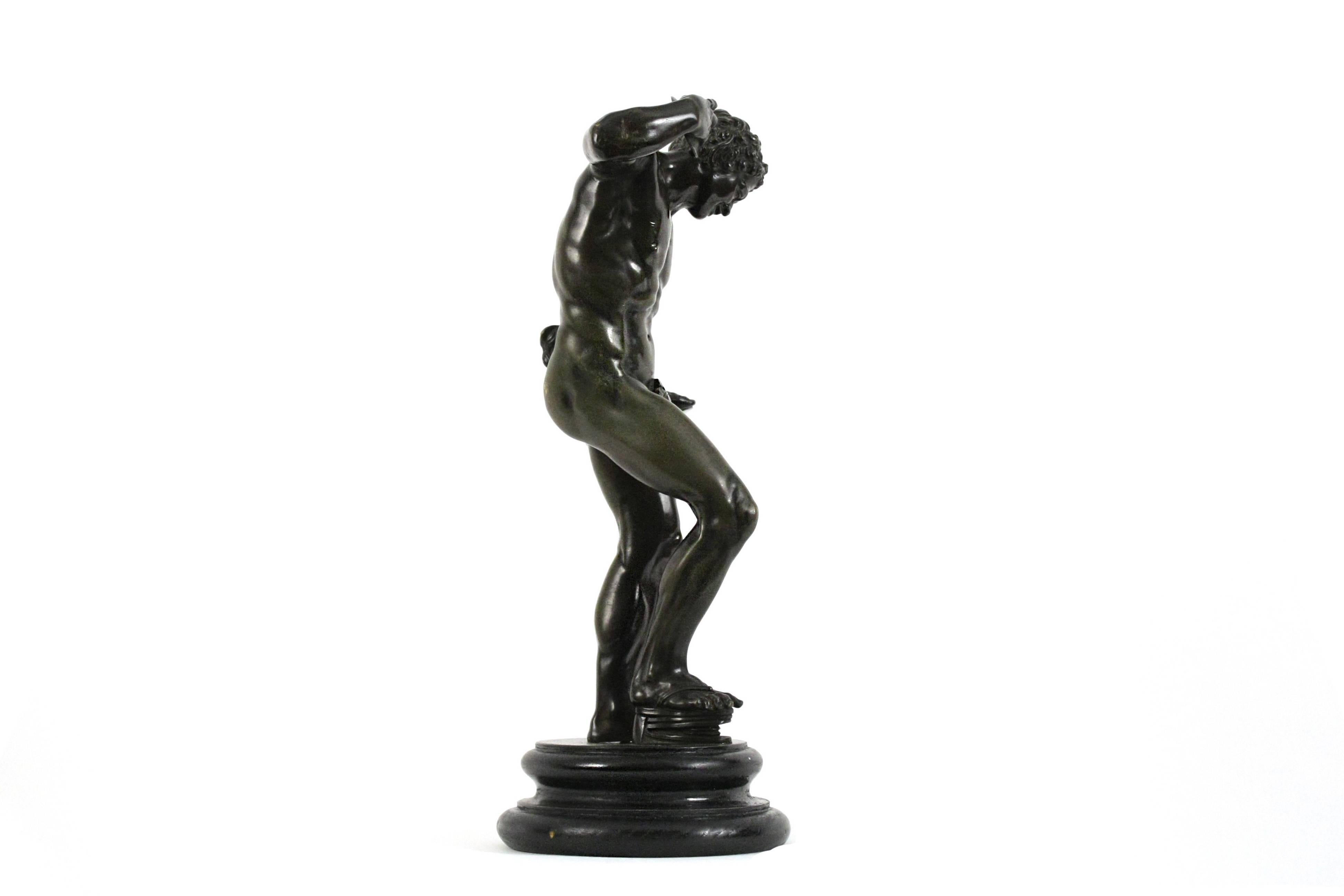 Bronze figure mounted on later wood base. This figure is based on the Hellenistic marble figure located in the Galleria degli Uffizi, Florence.

Italian, late 18th/early 19th century.
