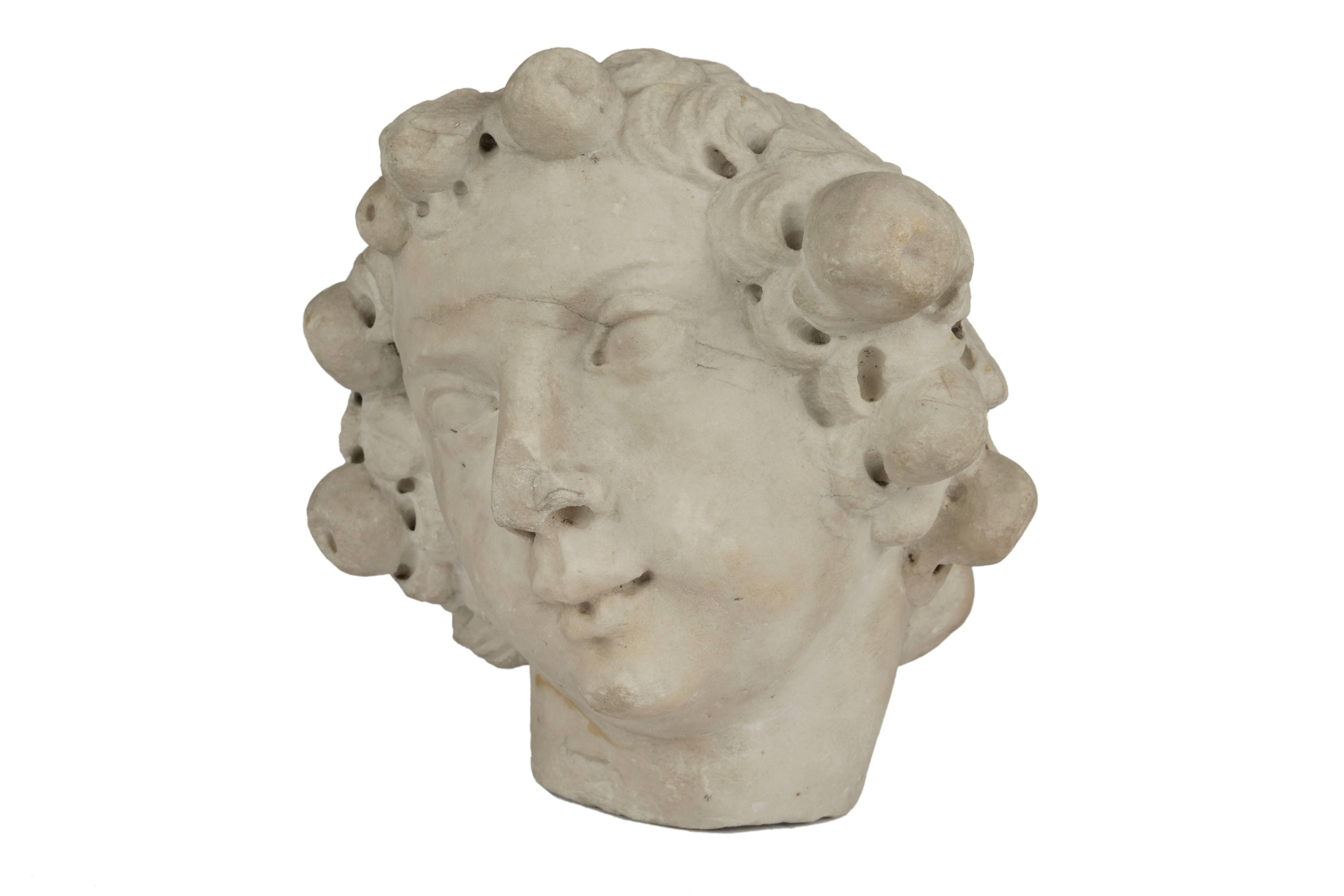 Head of Bacchic figure
white marble
Italy, late 16th-early 17th century
with fitted pedestal
Measures: H 9.5 in (24.3cm).