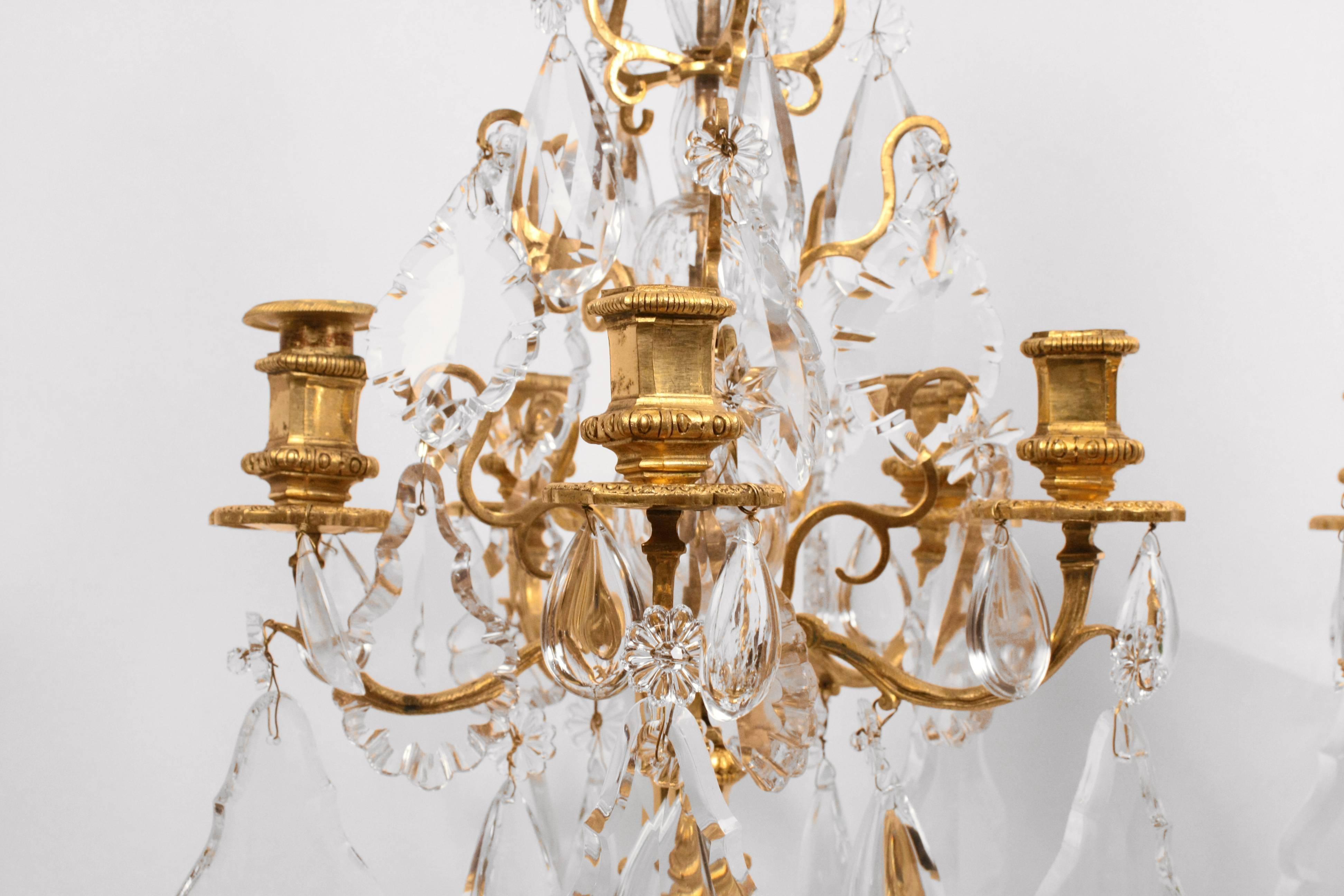 Pair of five-light gilt bronze Louis XVI style candelabra. 
France, 19th century.

Measures: H 27 in.

