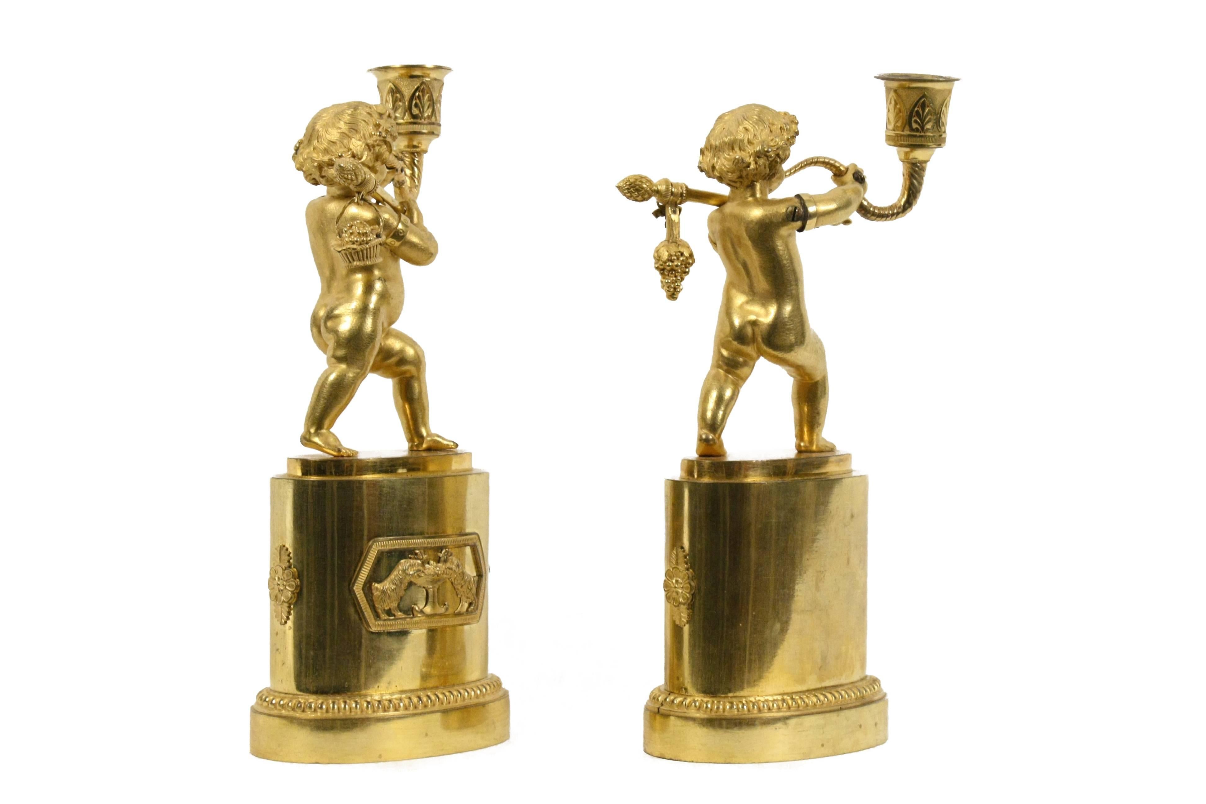 19th Century Pair of French Gilt Bronze Figural Candlesticks For Sale