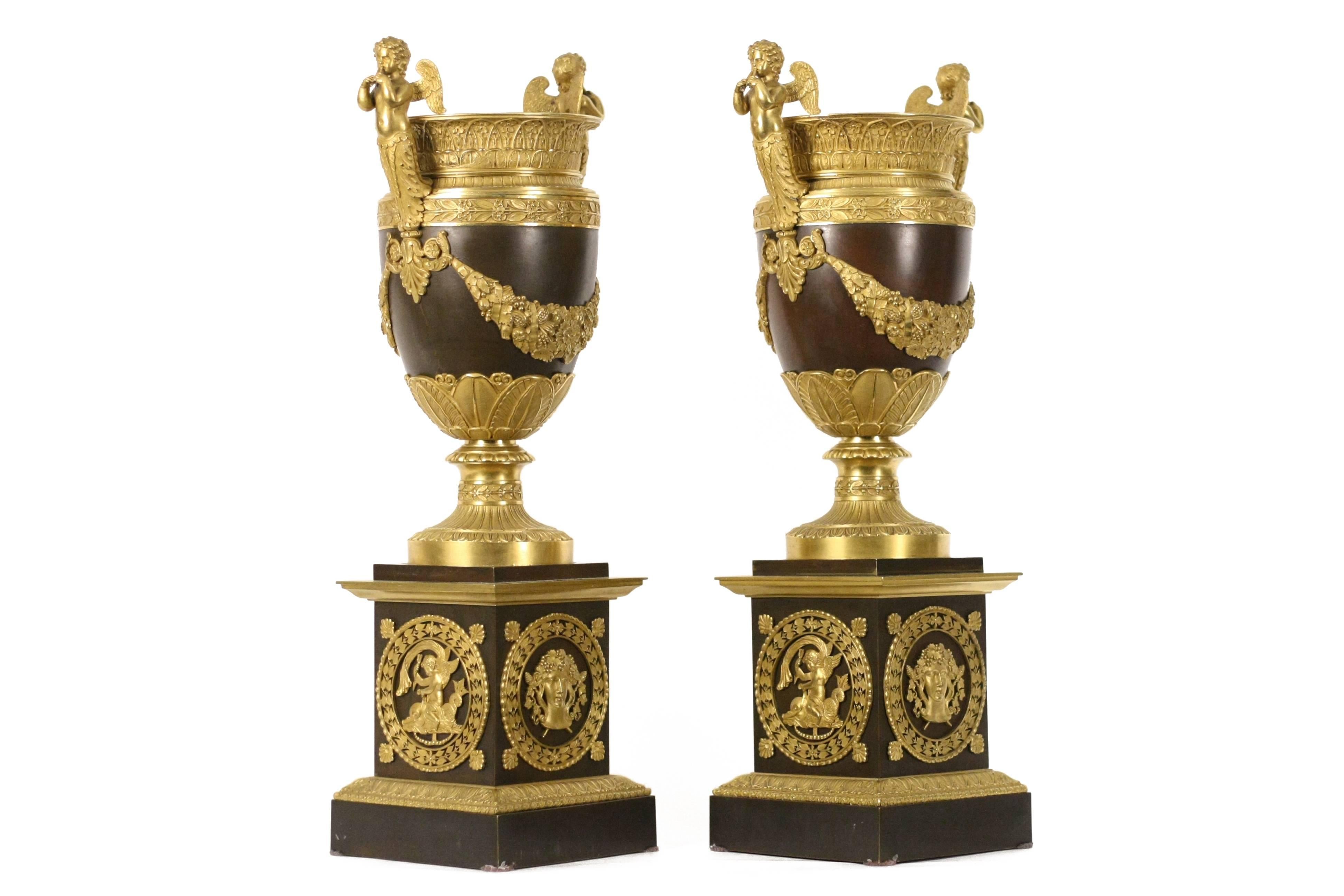 Superb pair of finely chased Empire gilt bronze mounted vases on square plinth. 
Vases attributed to Parisian bronzier Pierre-Philippe Thomire (1751-1843).