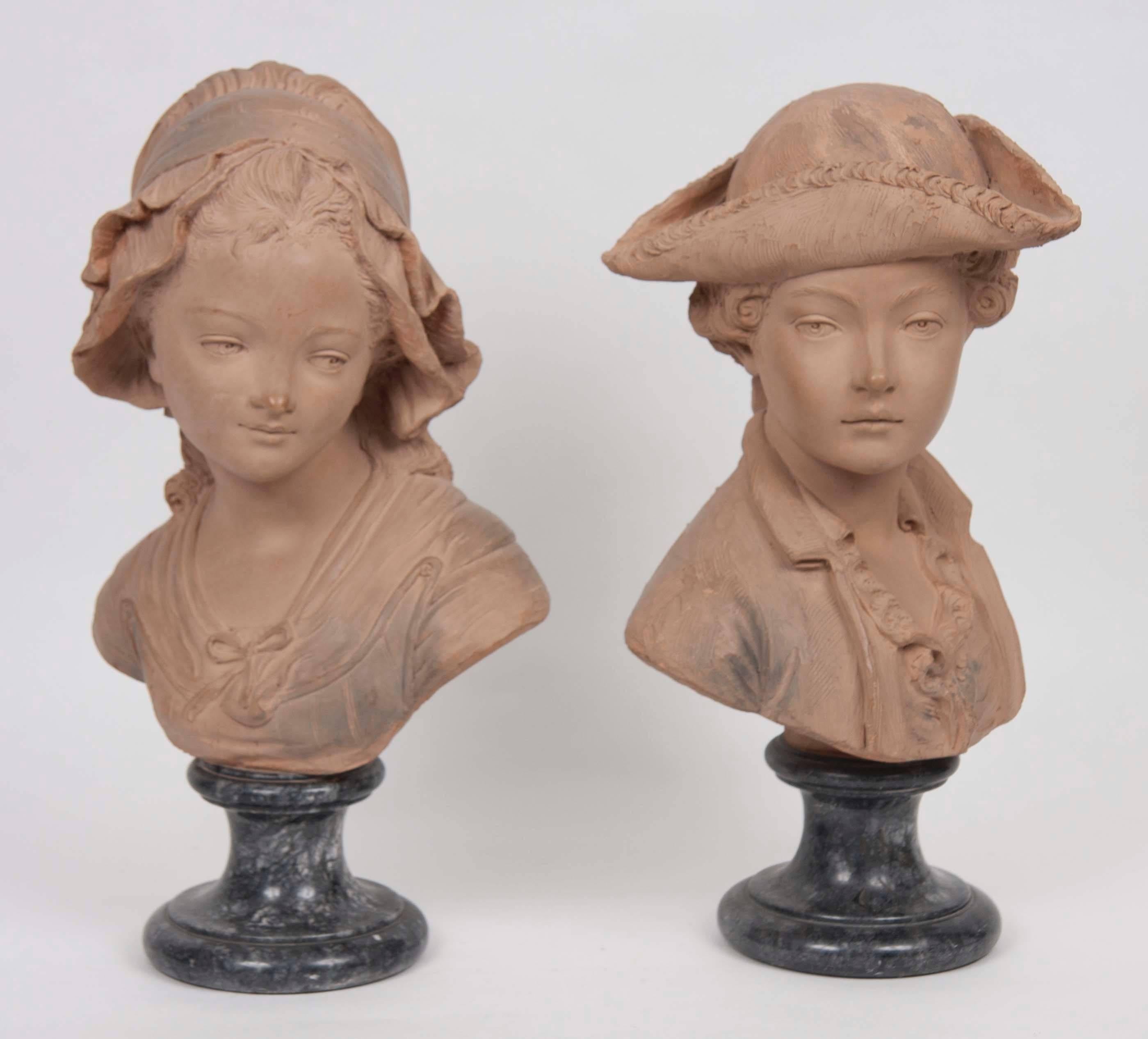 Two French terracotta busts mounted on marble socles,
France, late 19th century.
Signed, Paris. 

Female - H 19 in.; W 10in.; D 6 in.
Male - H 19 in.; W 12 in.; D 8.5 in.