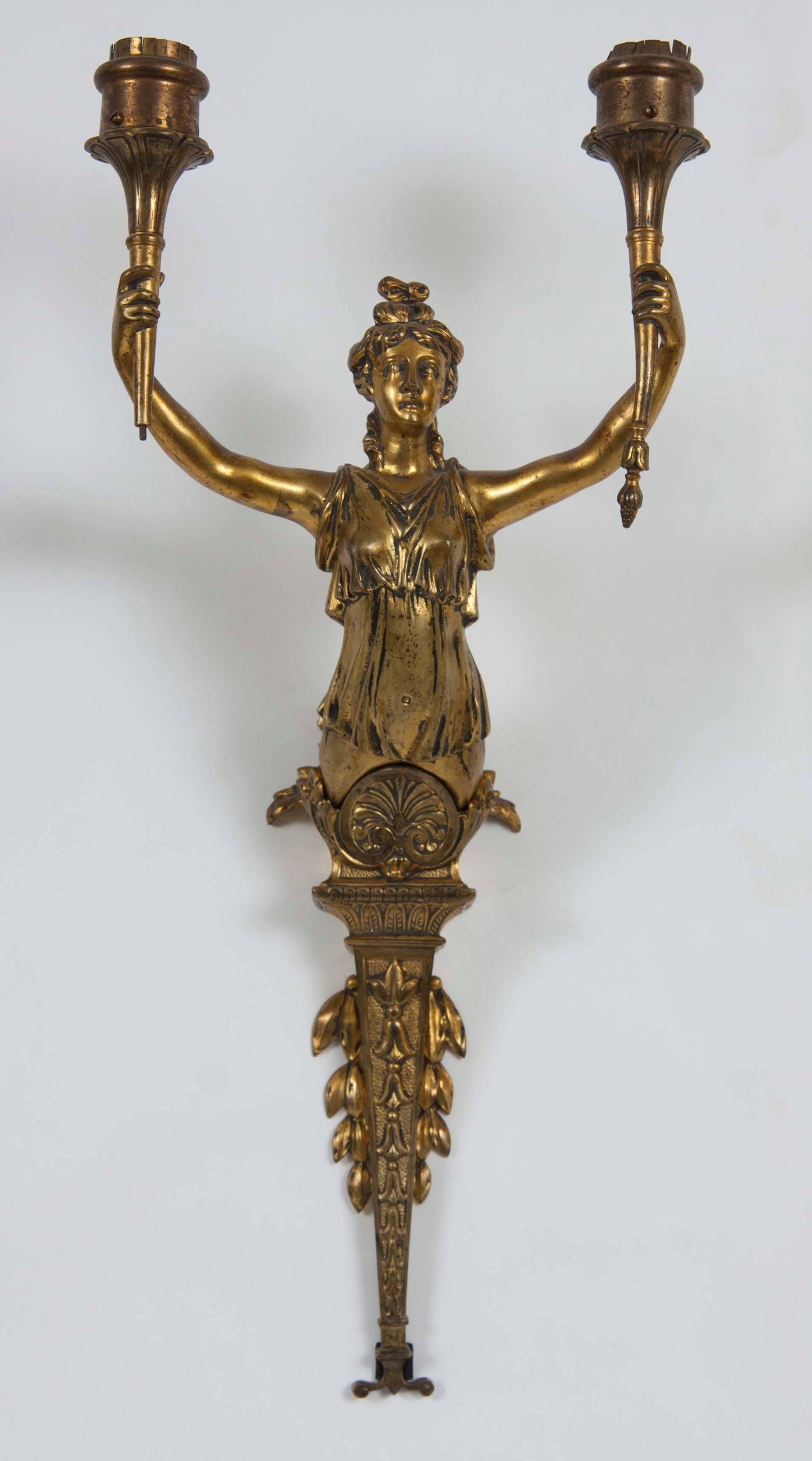 Pair of French figural two-arm wall lights, woman holding torches.