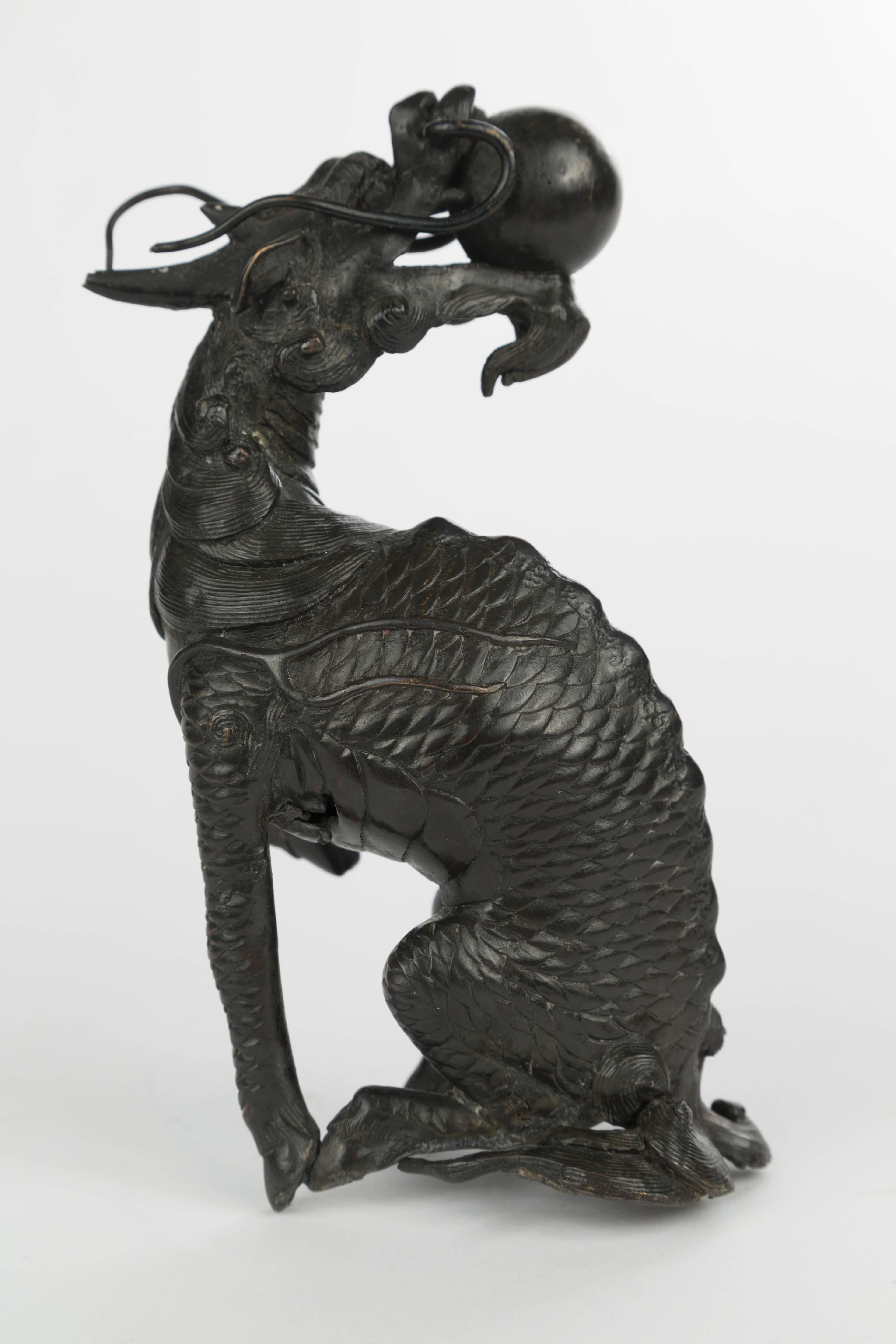 Qilin shown bearing the flaming pearl in his mouth.