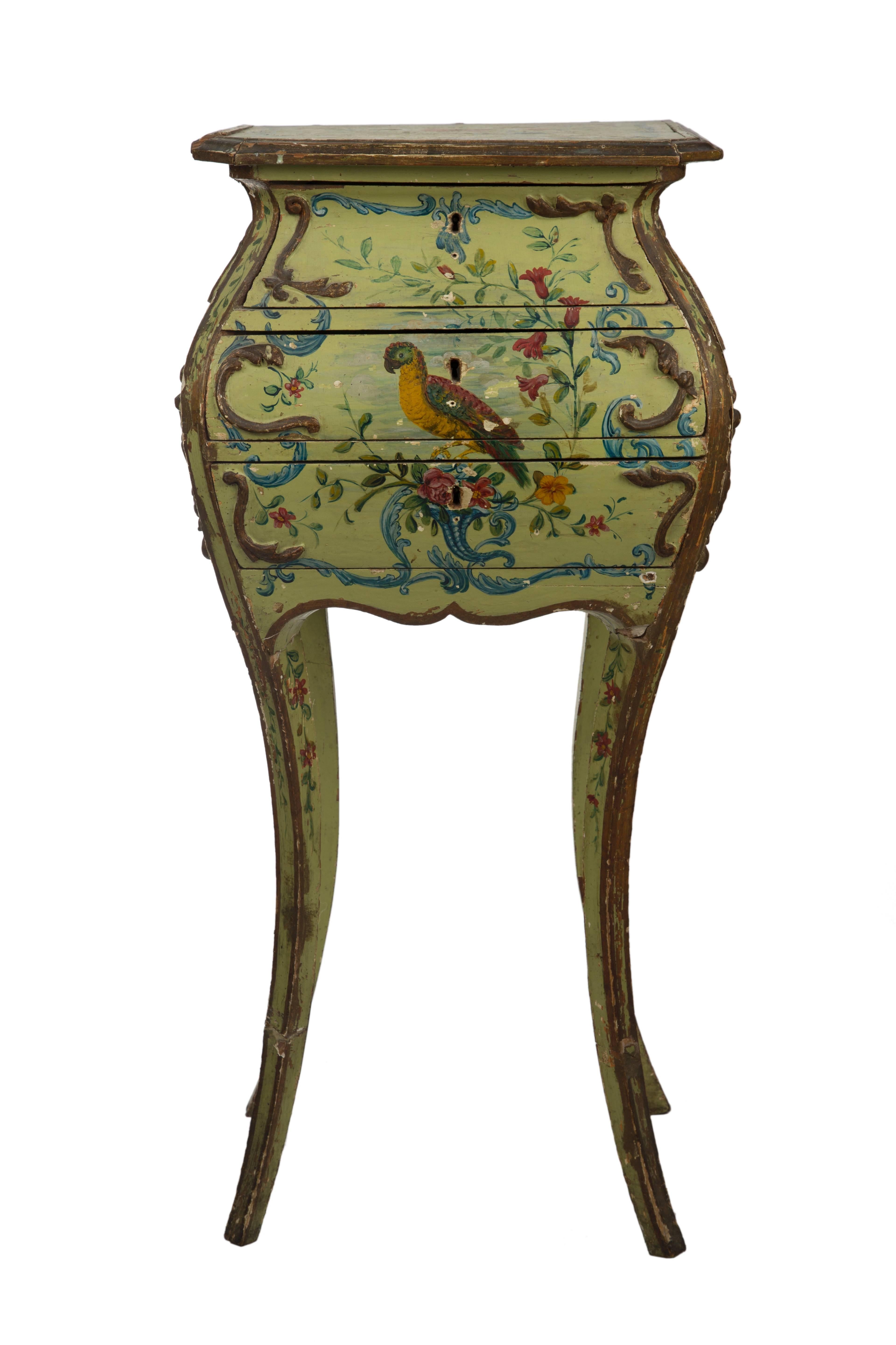 Venetian wood lacca povera three-drawer table, embellished with parrot surrounded within beautiful colorful floral motif.
Italian, 18th century.