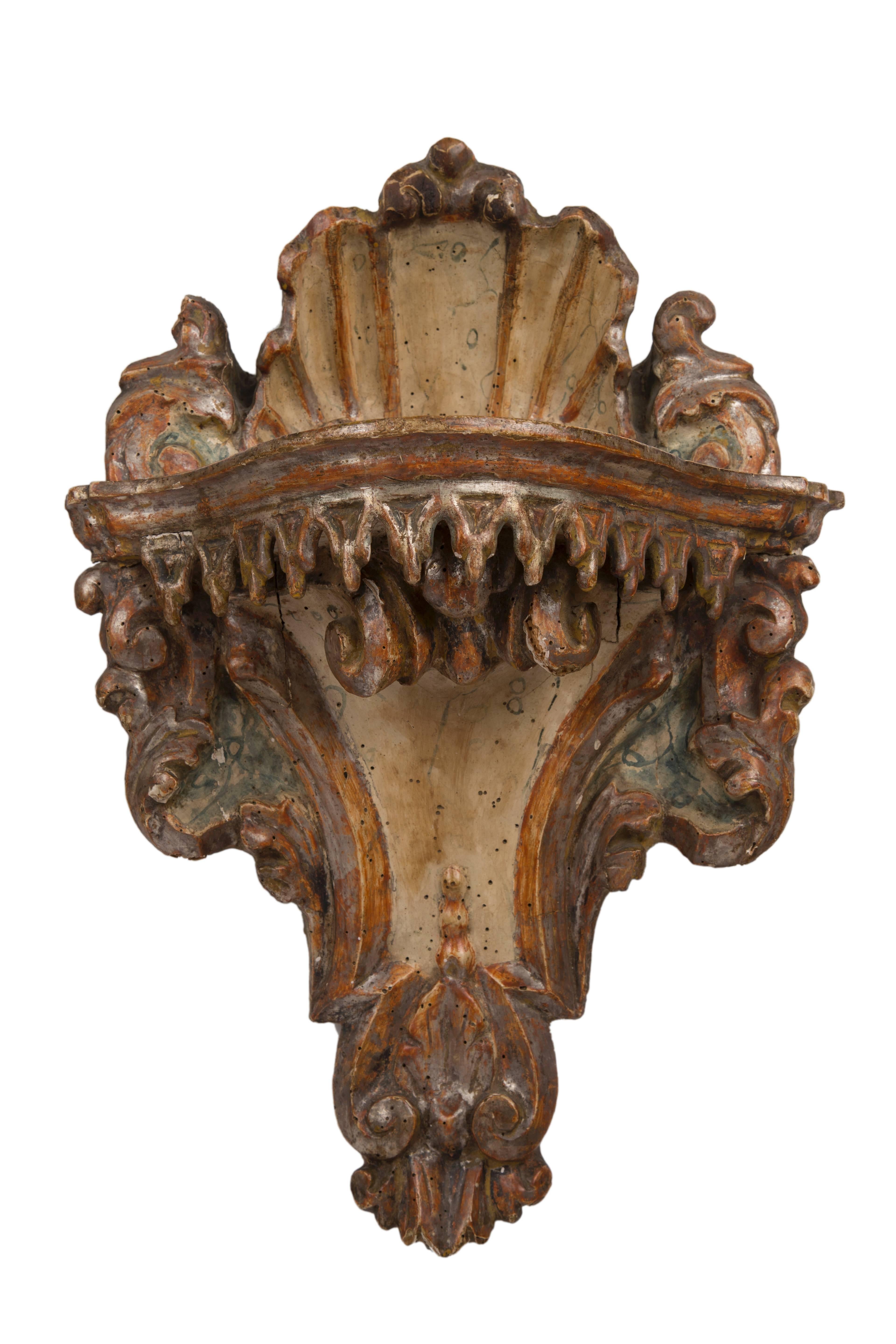 Rare pair of wall brackets, highly stylized lacquered carving.
Italian, 18th century.