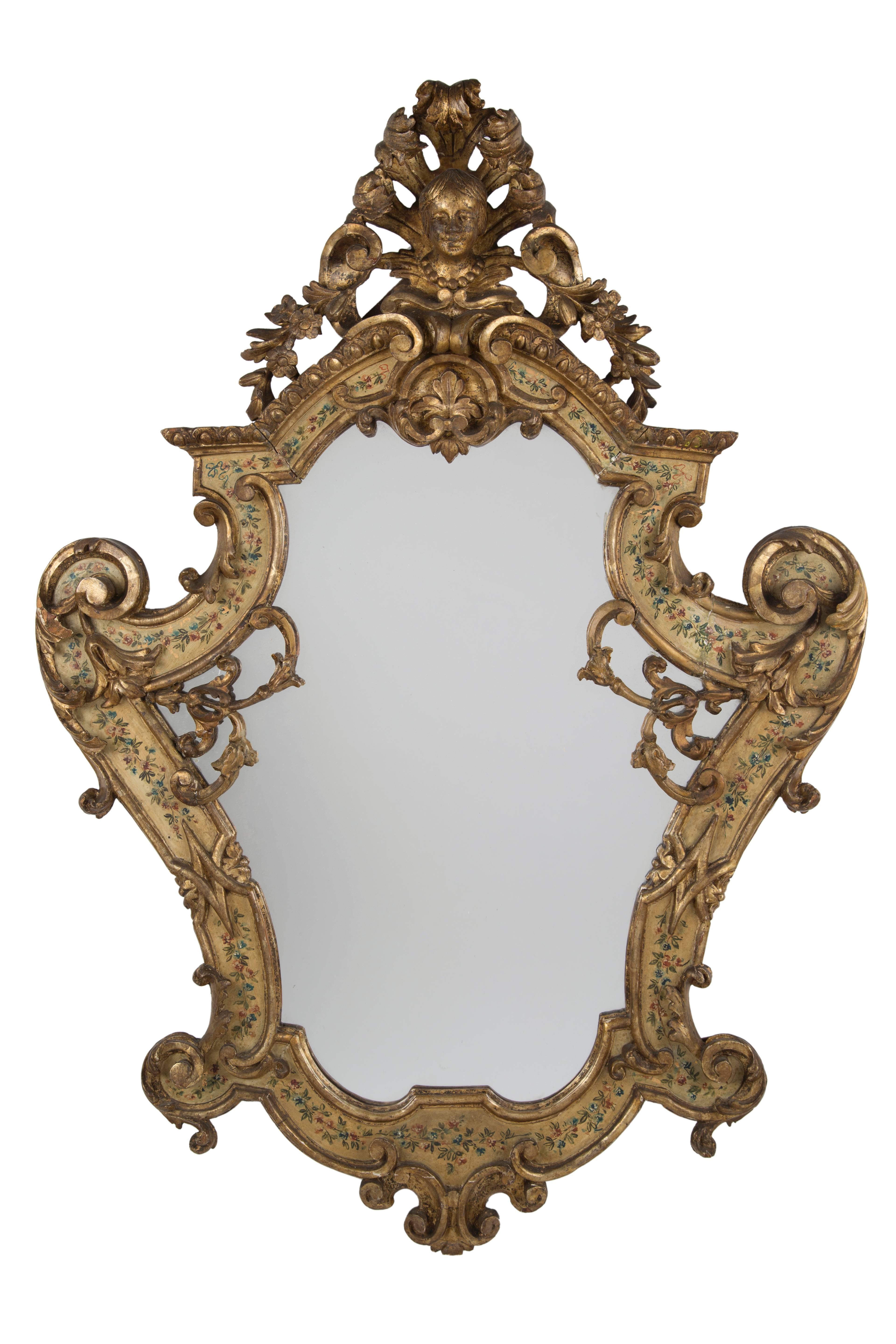 Pair of Louis XV carved giltwood polychrome mirrors with figural crown and ornate floral motif. First half, 18th century.
Height 38.5 in.