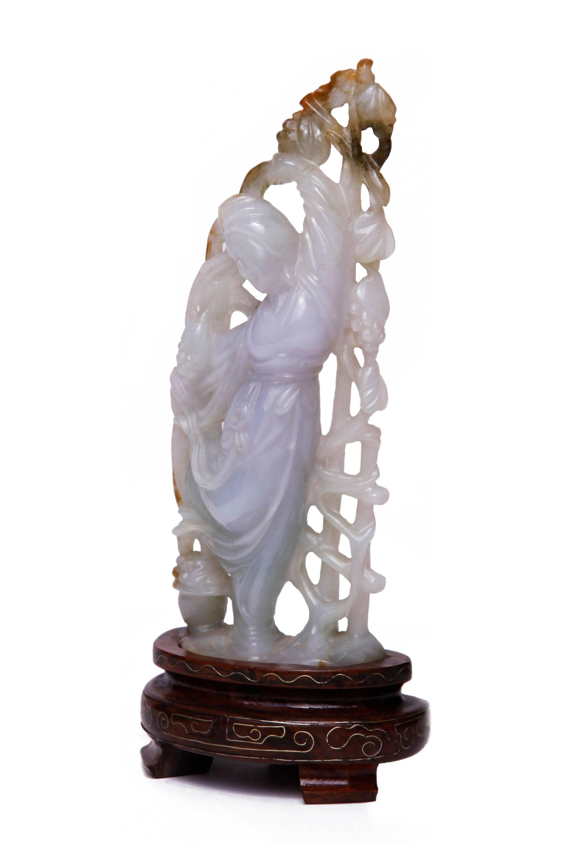 Sculpture of Guanyin
White lavender jade mounted on wood base
Early 20th century.
 