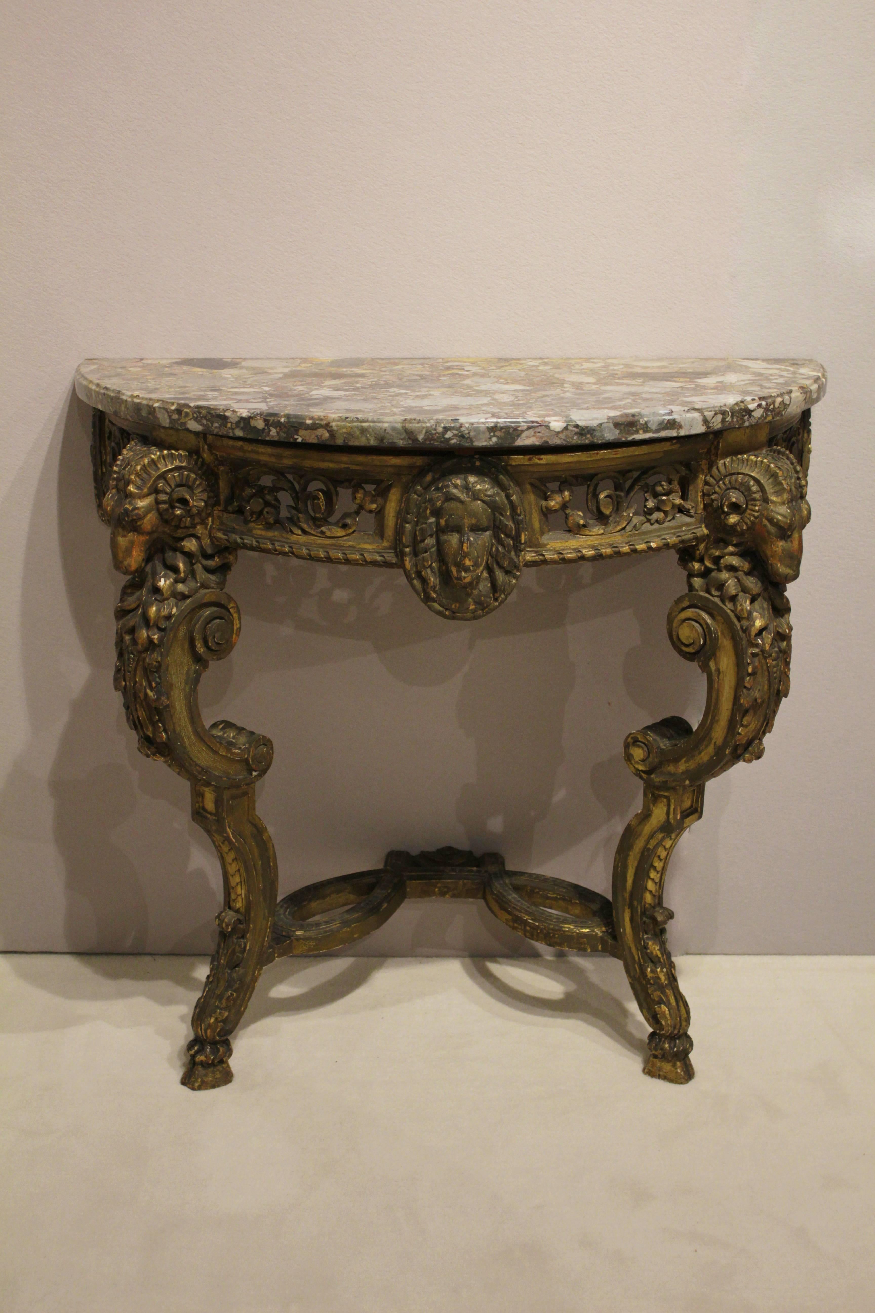 Pair of Italian carved giltwood console tables
demilune with marble top,
Italy, late 18th century.
Measures: H 32in., W 32.25 in.