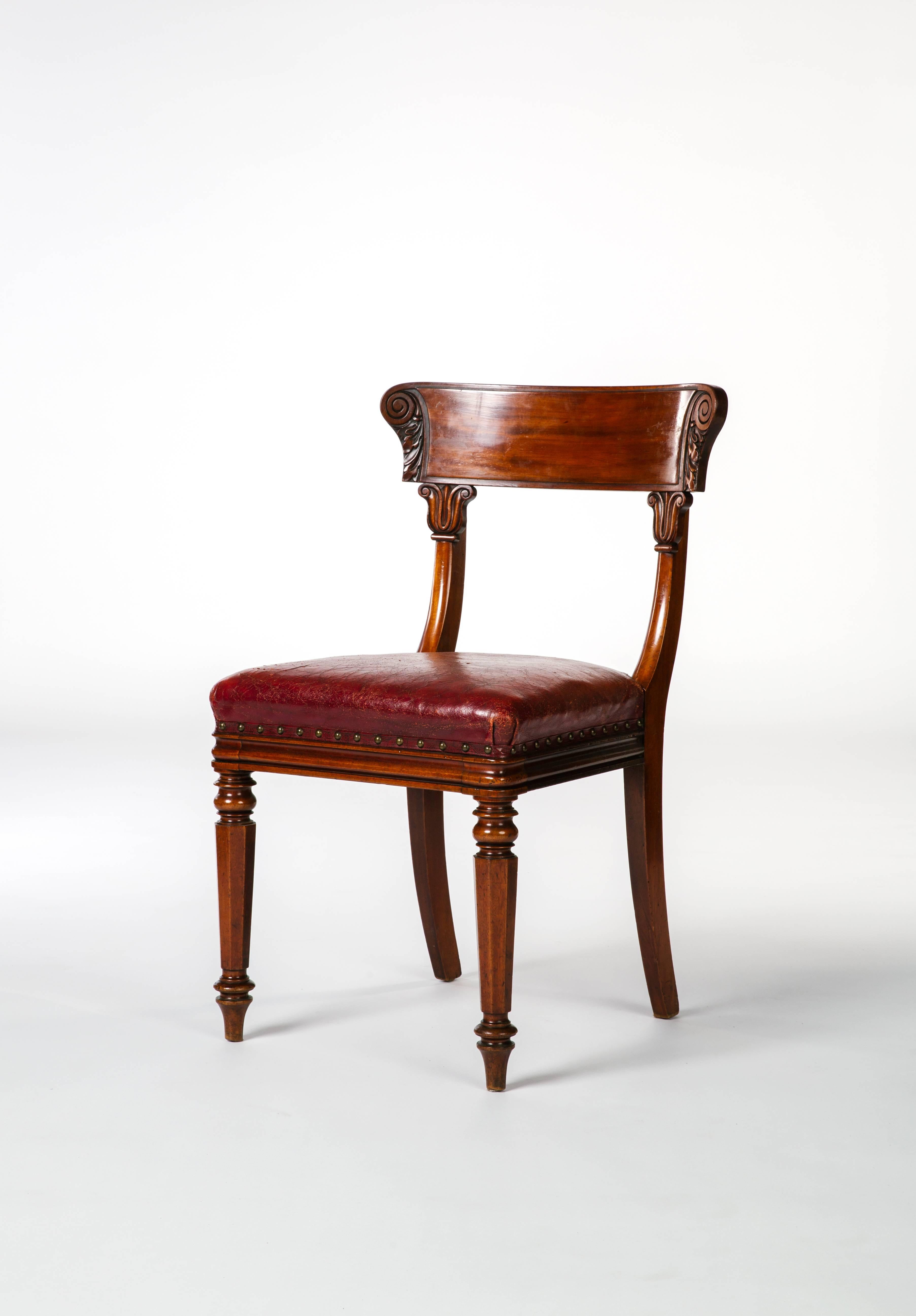 This is a beautiful set of late Regency mahogany side chairs with antique red Moroccan leather upholstery,
circa 1820.