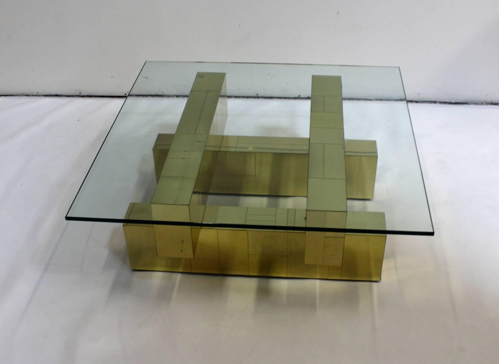 A vintage brass coffee and cocktail table with square glass top, produced by Paul Evans in the 1970s in his iconic 'cityscape' style. Good vintage condition with age appropriate wear and patina, some minor scratches and dents. Signed "An