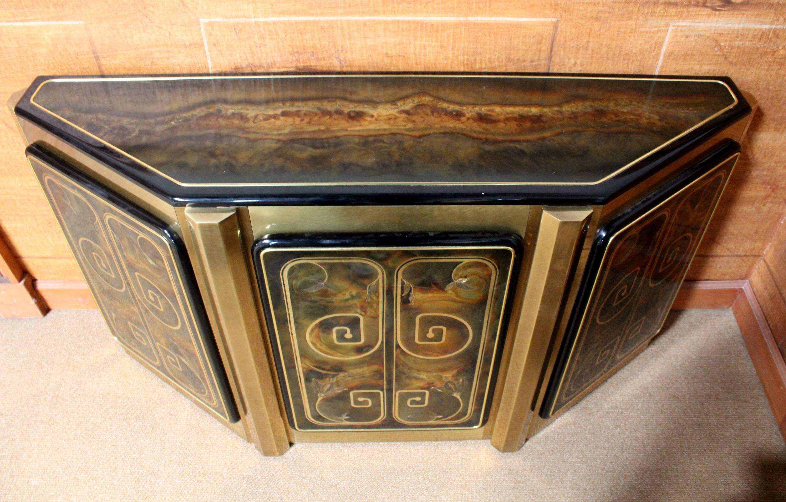 Stunning console from Bernhard Rohne for Mastercraft, circa 1970s.
Acid etched brass and black laminate.