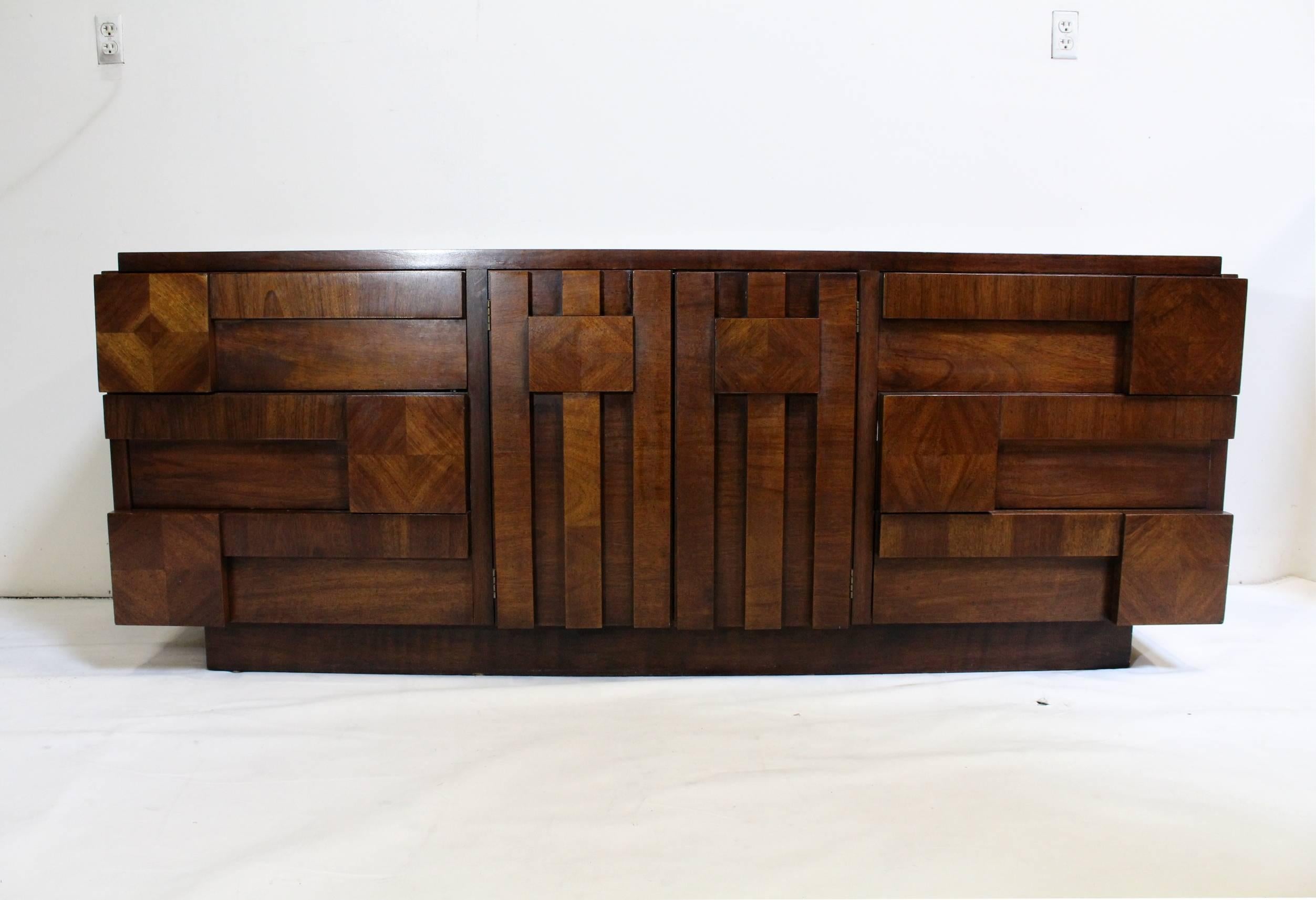 Iconic and sought-after, nine drawer, Brutalist credenza or dresser by Lane Furniture. Stamp on back dates it to 1973. Light surface wear consistent with age. Has a small chip on top left (pictured).