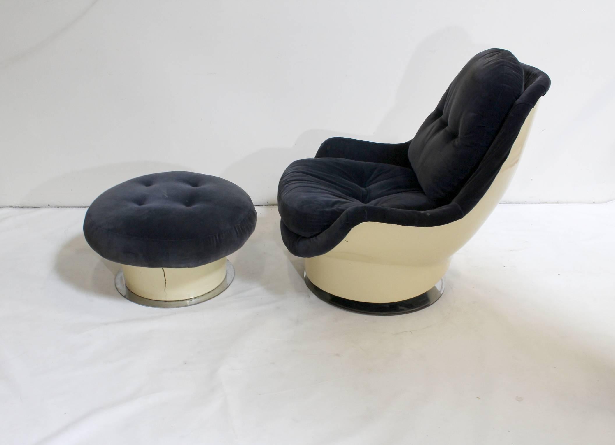 1970s lounge chair and ottoman set by Milo Baughman for Thayer Coggin. Very comfortable chair, fabric on plastic shell raised on chrome base with springs. Rocks and swivels. 

Plastic on chair is lightly yellowed and scratched and chrome base has