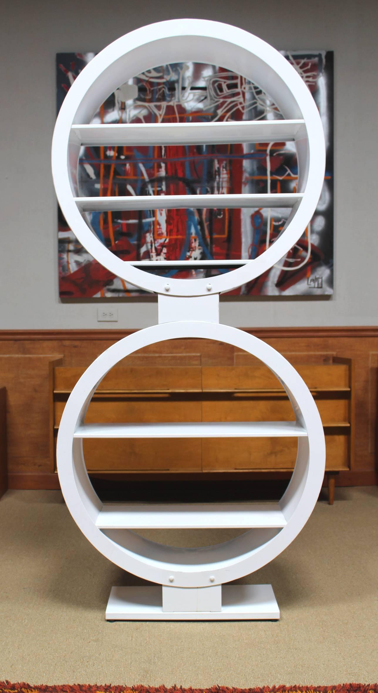 Large, sculptural Mid-Century display shelf, high-quality Industrial lacquered steel. Two riveted circles with five shelves on podium style foot.