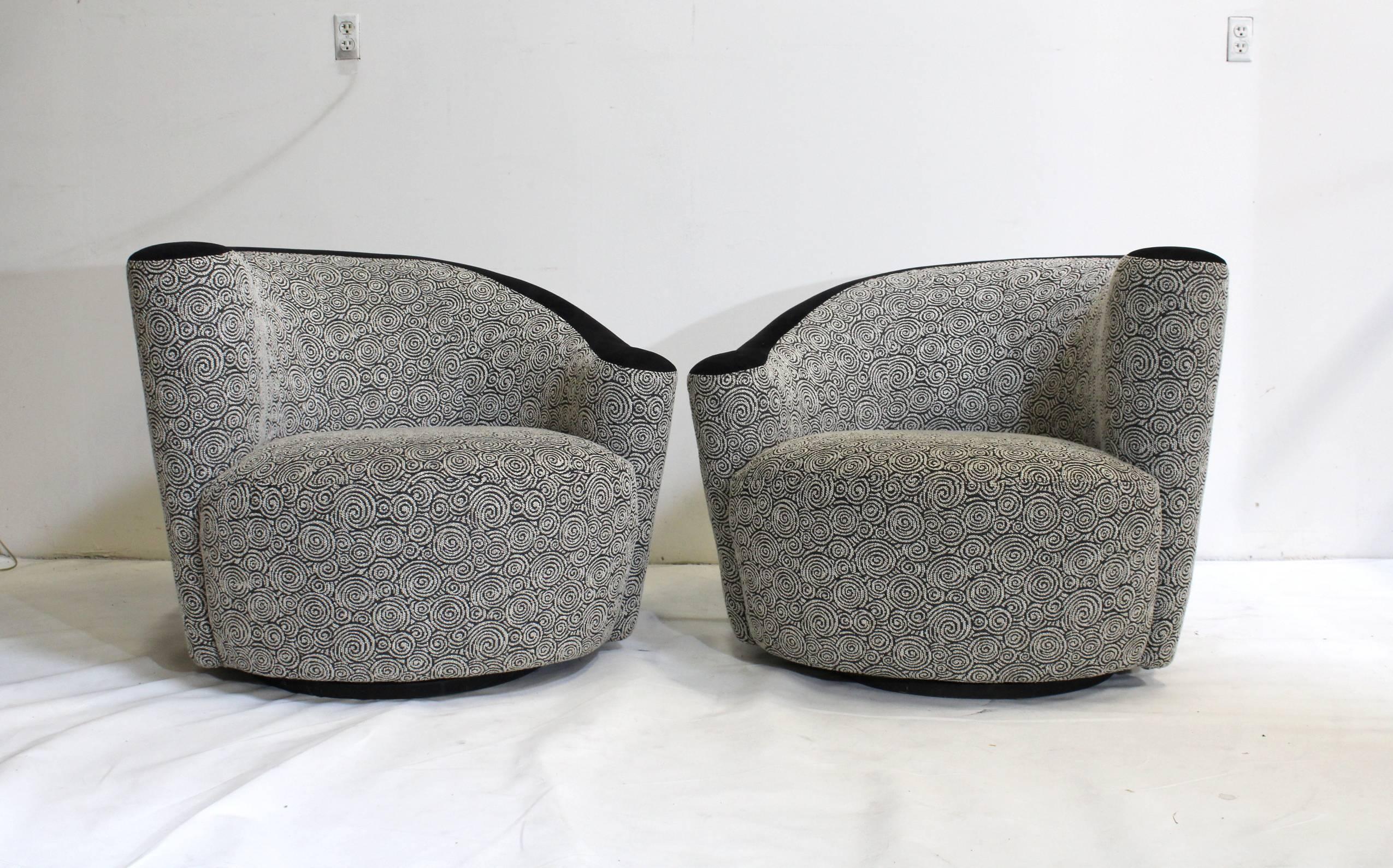Opposing pair of Kagan's iconic Nautilus swivel chairs, upholstered in amazing wool-like grey spiral pattern with black ultrasuede accent. Fabric is in great condition!

We also have a matching opposing pair of Vladimir Kagan serpentine sofa's in