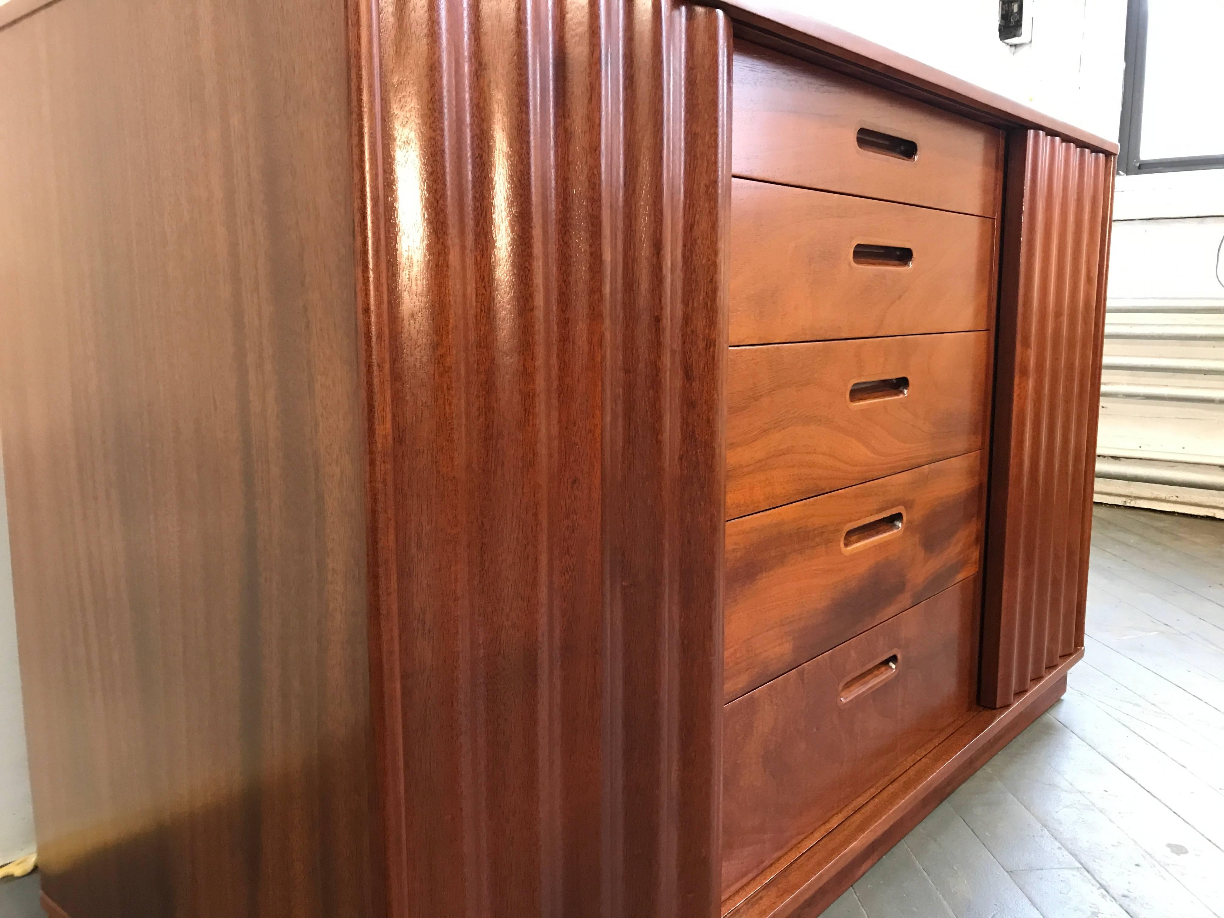 Newly Restored Mahogany cabinet by Edward Wormly.
Cabinet has five drawers and two doors, each revealing adjustable shelves. Dunbar imprint.
   