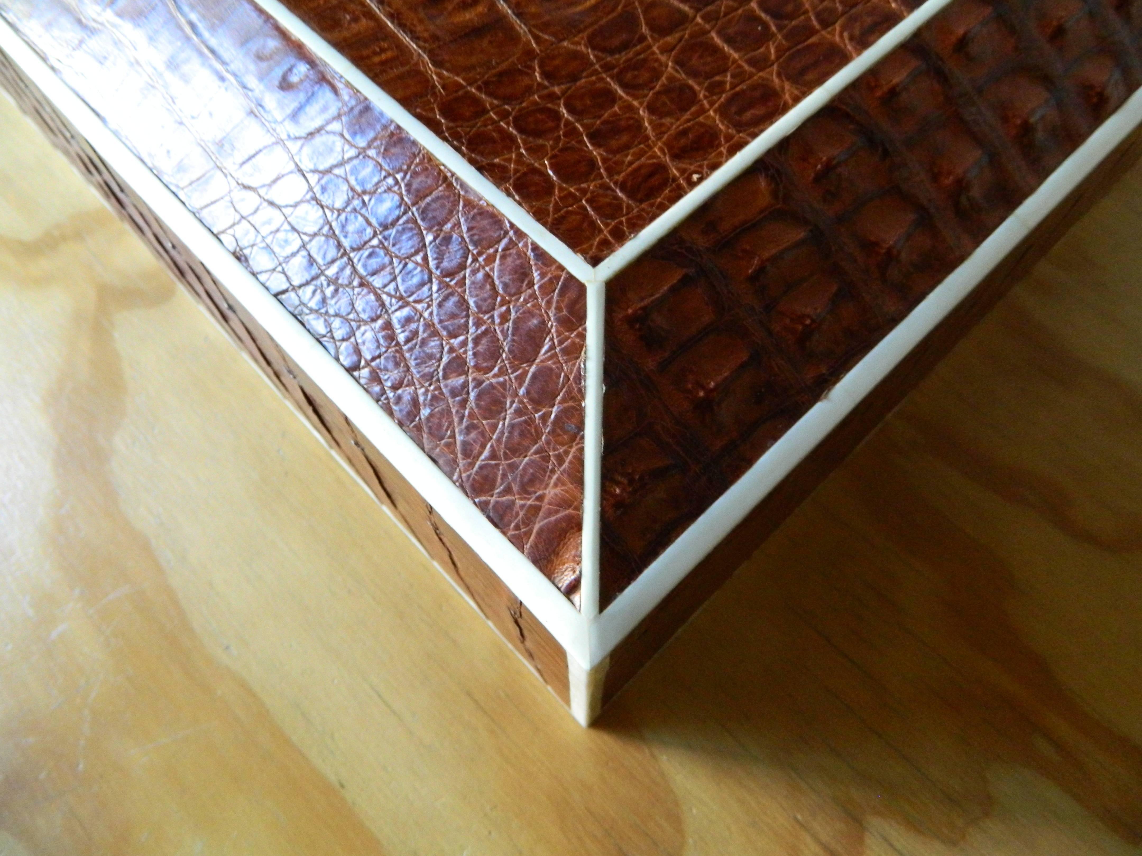 Large brown real crocodile skin box with bone inlay. Box has a removable compartment tray. interior made of massacre ebony wood.

