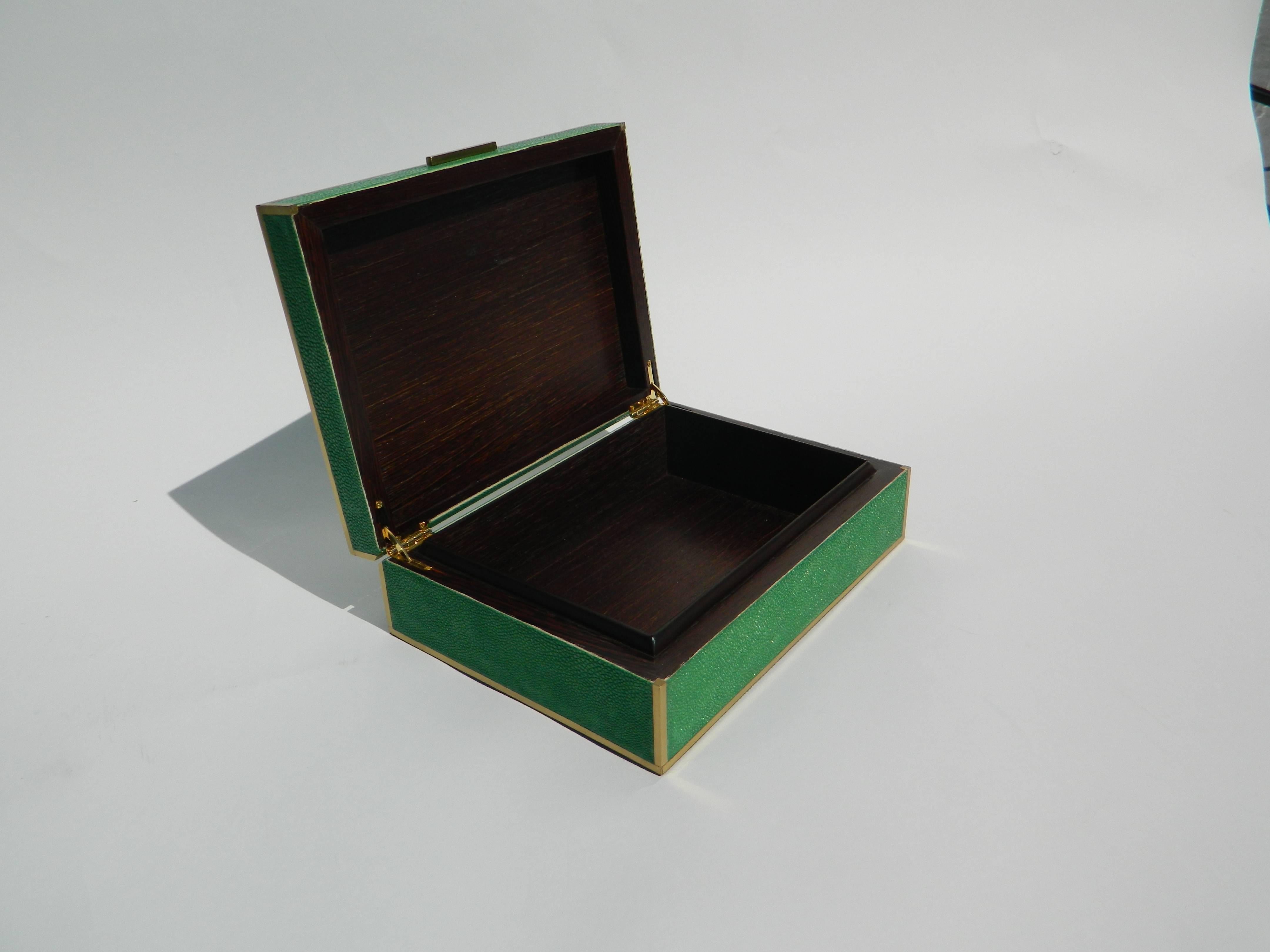 Beautiful emerald green shagreen box with brass inlay.
Galart specializes in boxes, humidors, trays, lamps and other high quality objects. We can custom make any shape, color and size.
Please contact us for any other information.