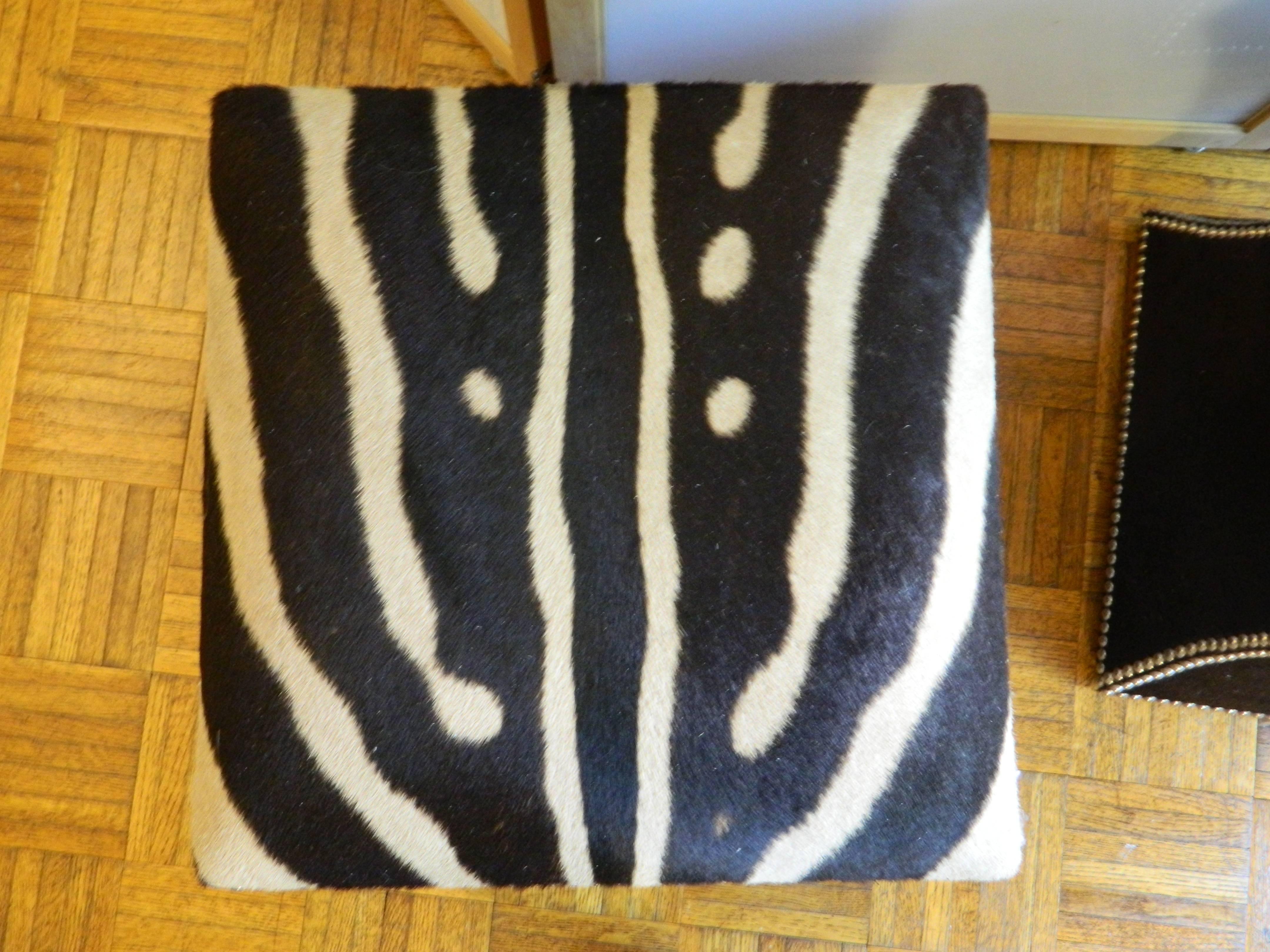 Modern Burchell Zebra and cow hide ottomans For Sale