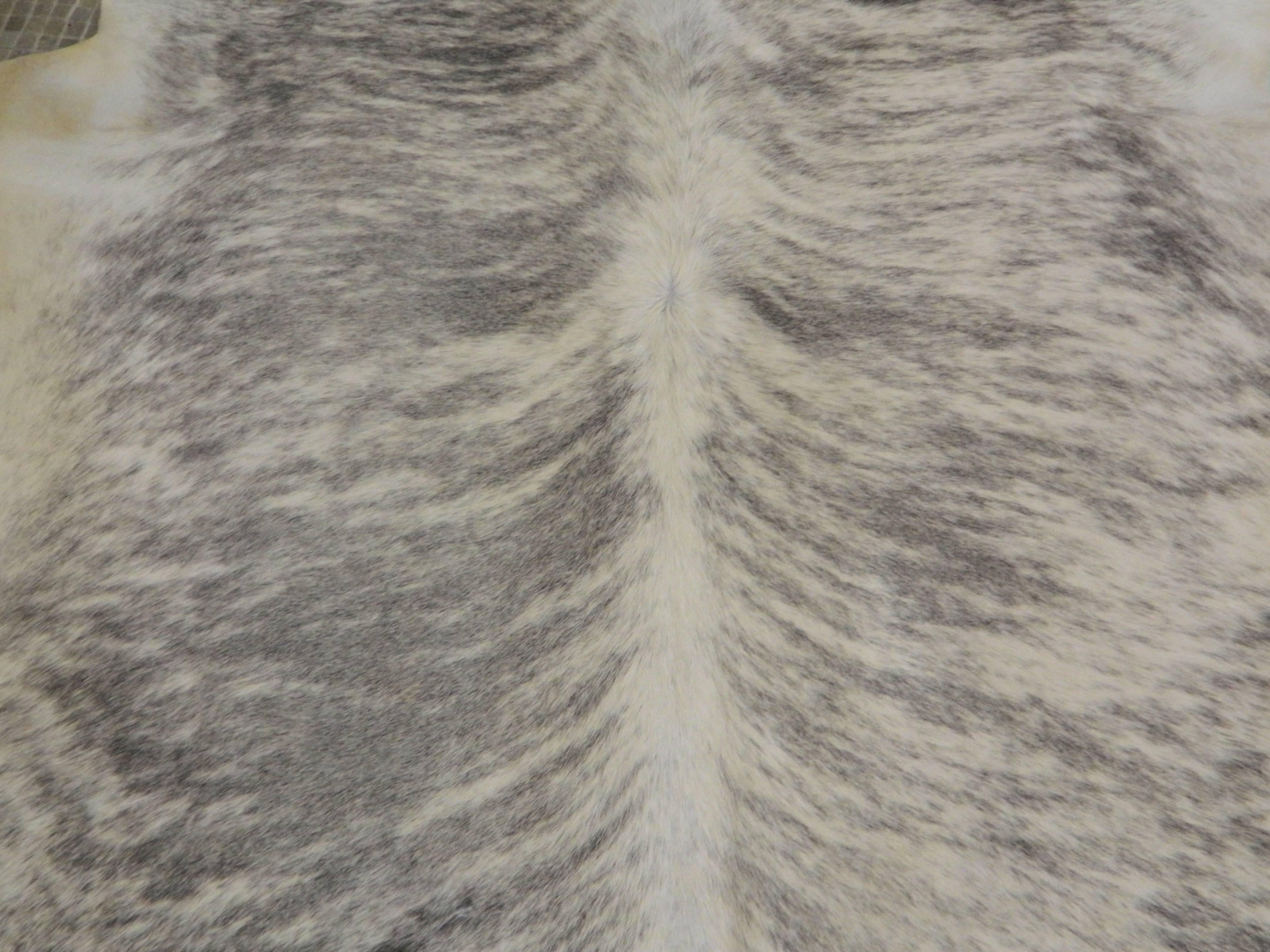 Top quality Brazilian Light Grey brindle cowhide 
Approximately 40 square feet
We also custom make pillows and rugs