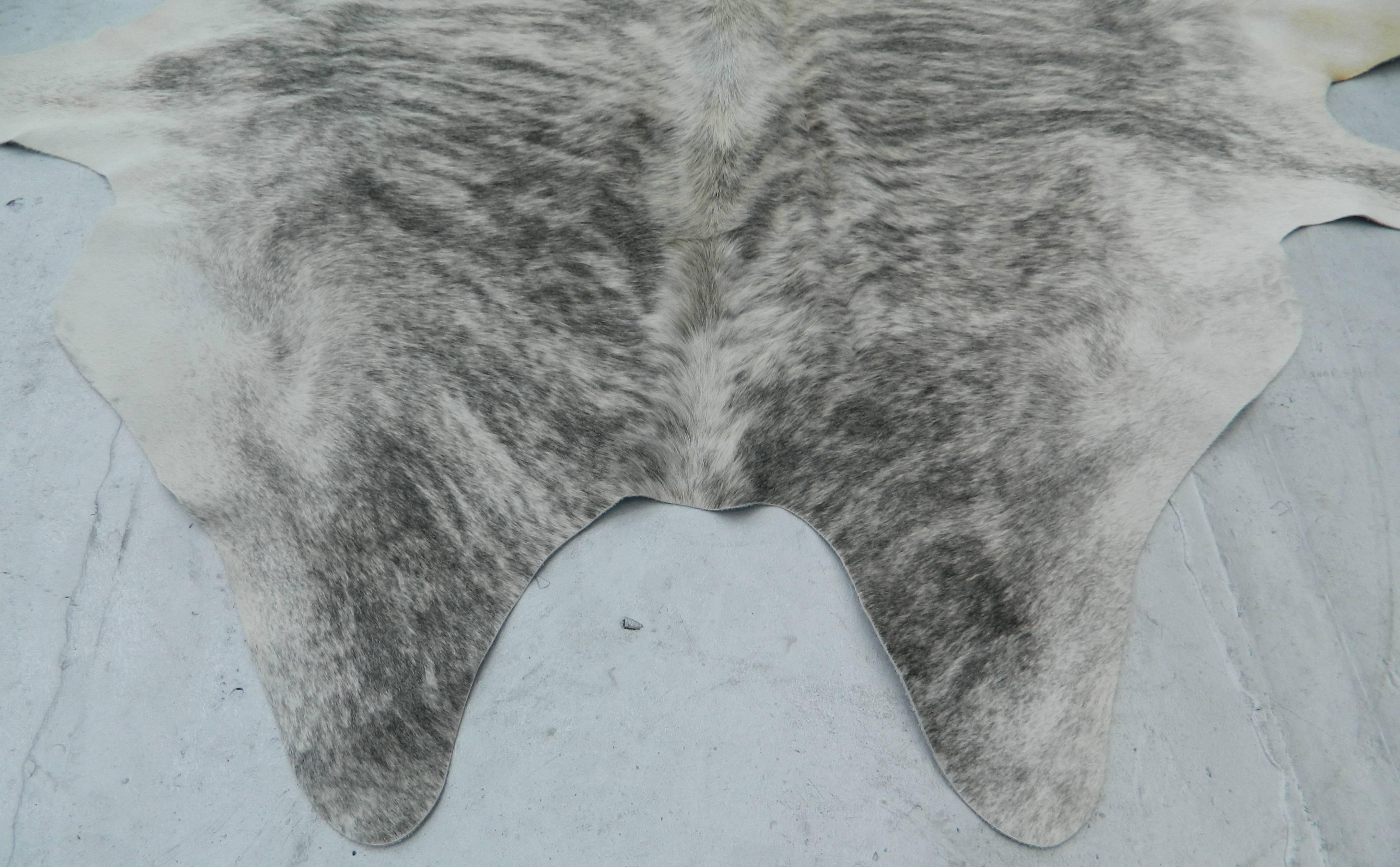 Best quality Brazilian Grey and White cow hide rug
Size: 88''L X 60''W
