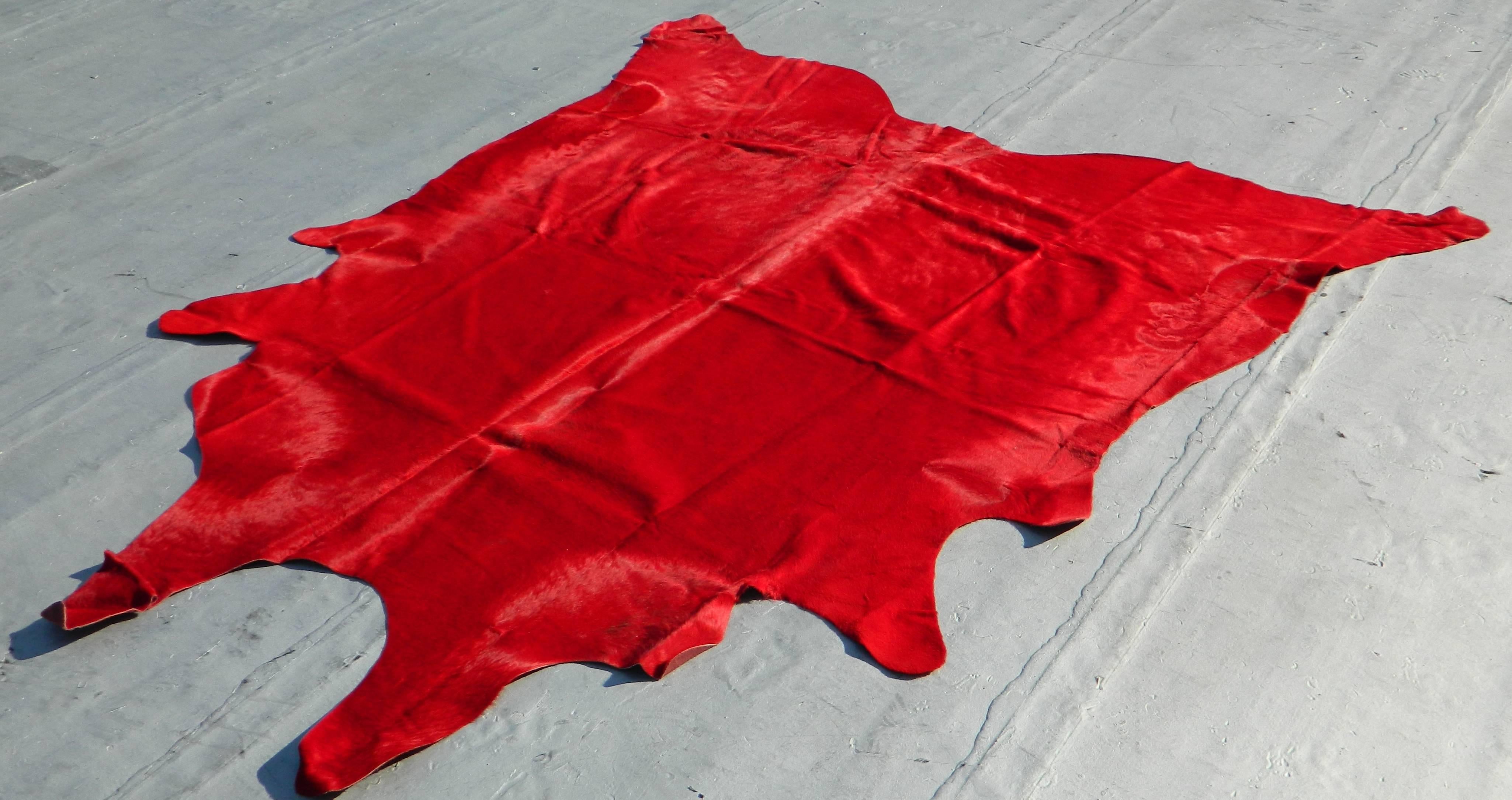 Beautiful Brazilian red cowhide rug
Size: 90'' L X 73'' W
