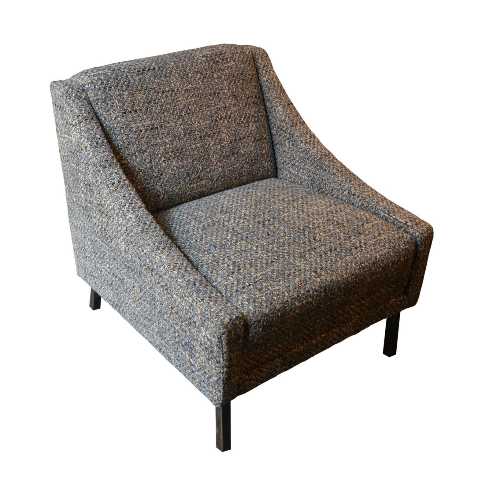The original vintage structure has been reupholstered reupholstered in a light blue, white, pink and gray wool bouclé. The simple metal feet are in burnt iron.