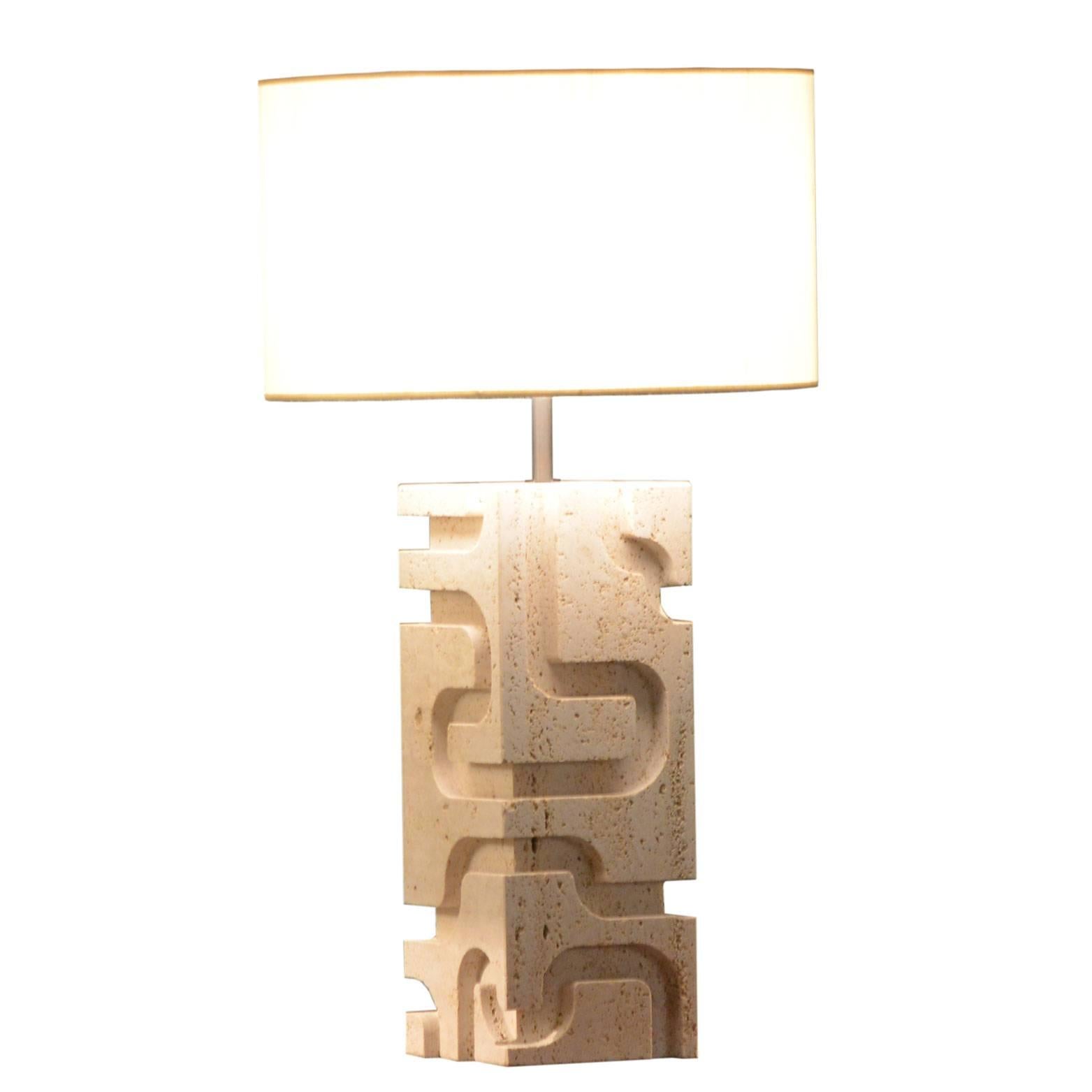 The lamps have been realized by our master artisans in whithe, open-pore travertine. The shades are in silk shantung. The diameter of each shade is cm 45.