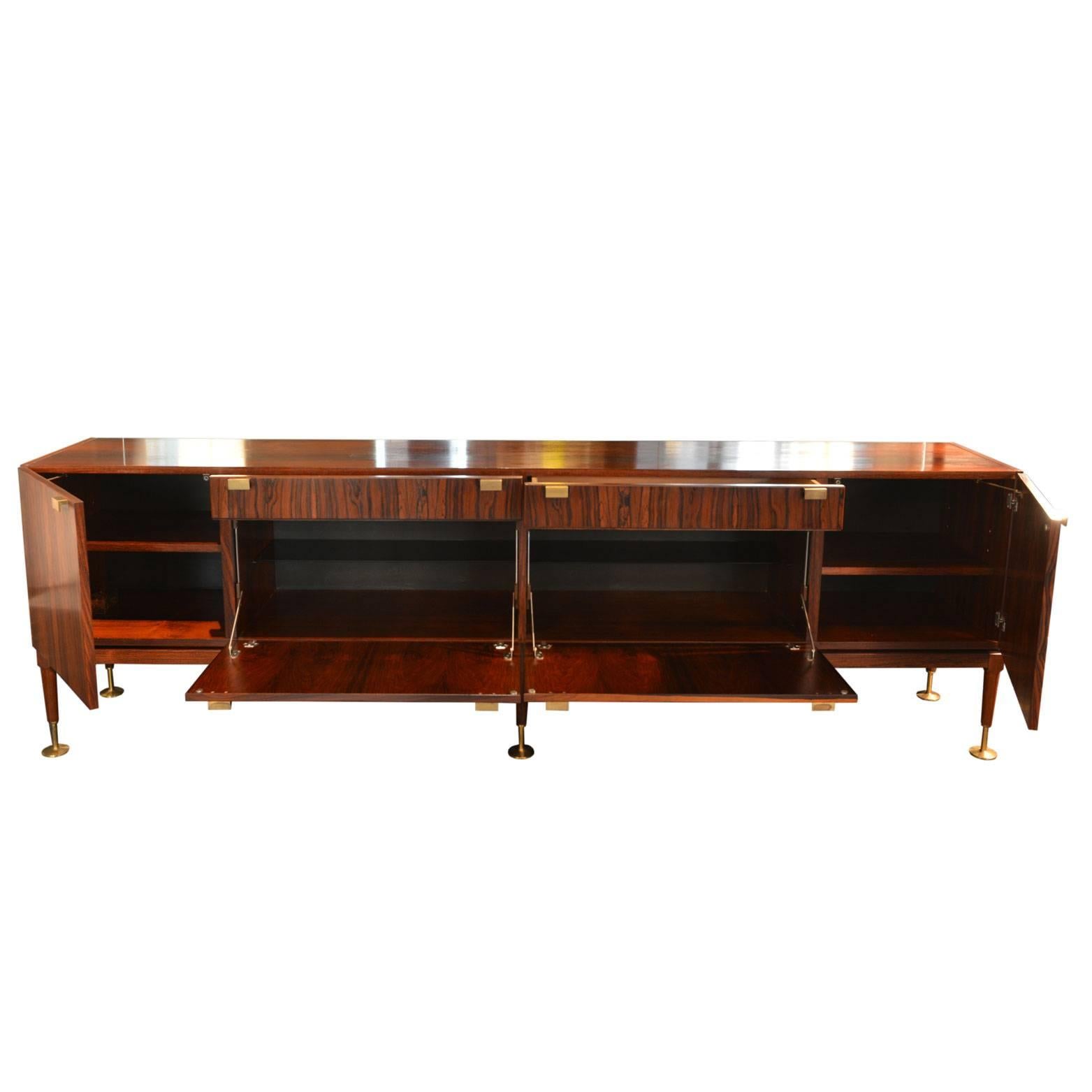 The sideboard has been realized in Scandinavia in the early 1960.
Beautifully crafted brass handles, feet and hinges.
 