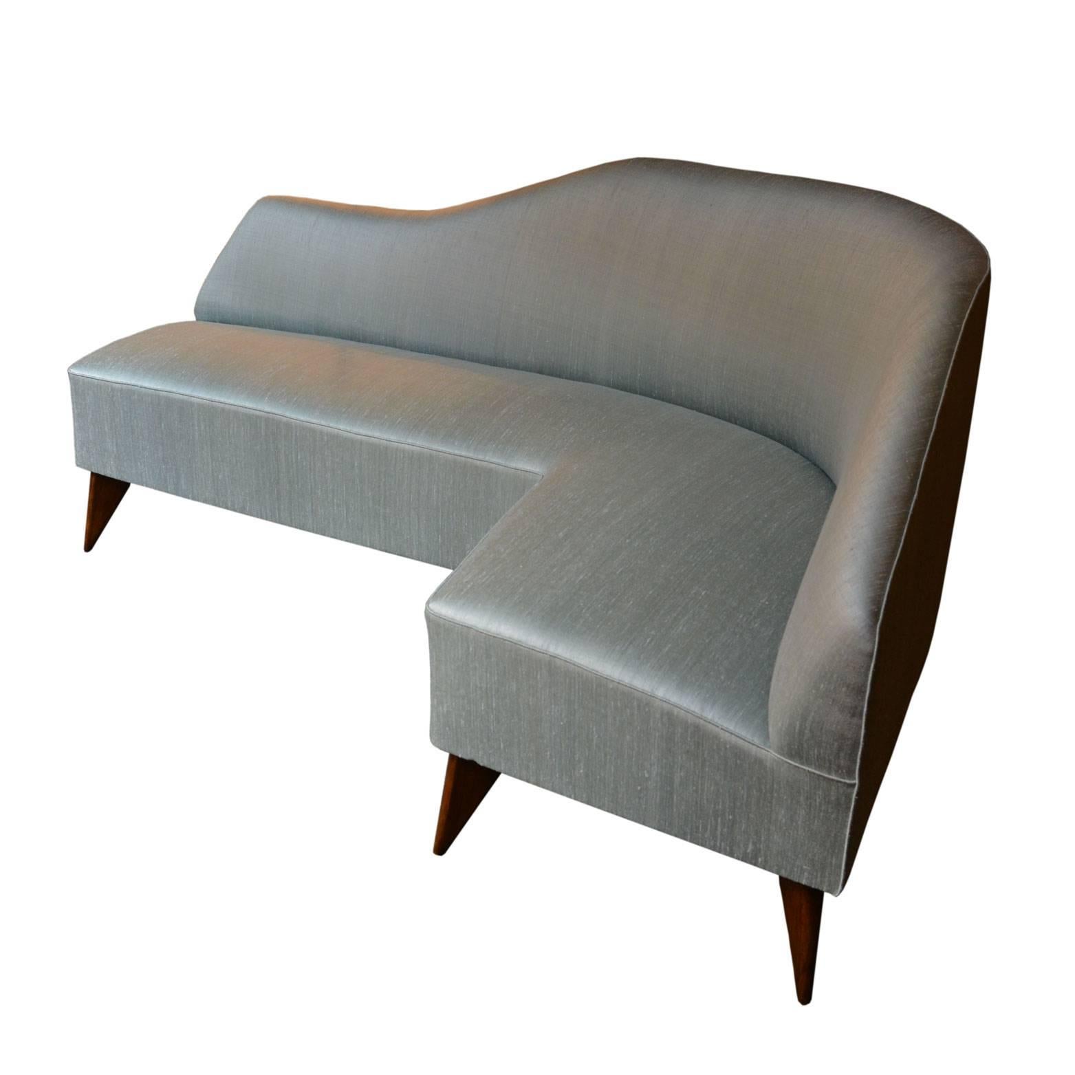 Rare curved sofa by Guglielmo Veronesi. The original vintage structure has been reupholstered with a dust color silk shantung.
