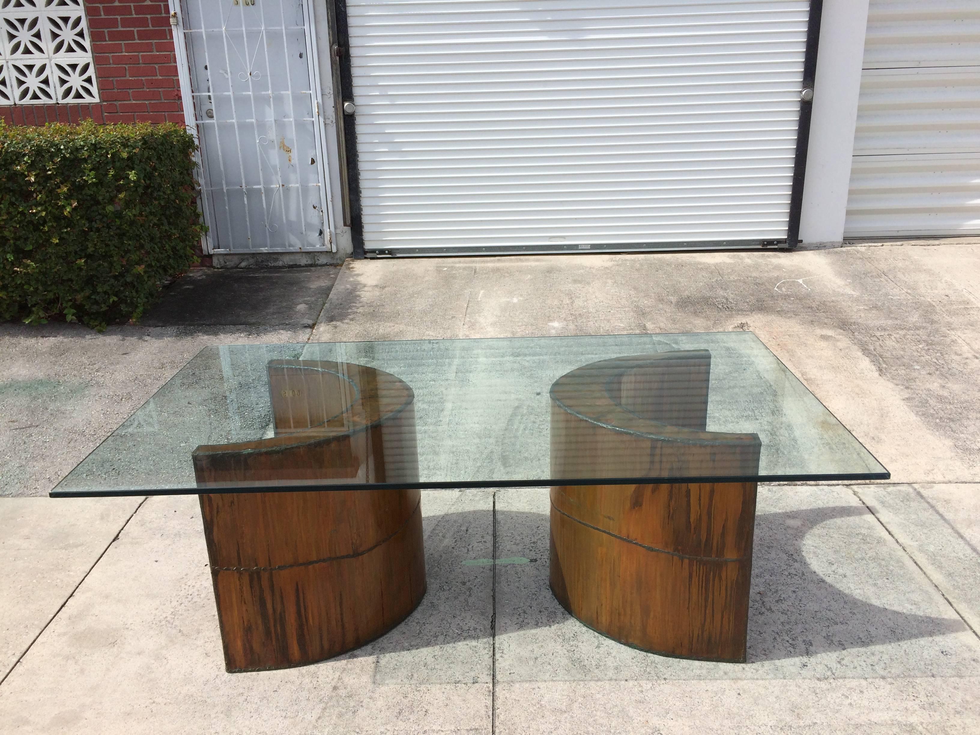 Two crescent shaped welded copper pedestal bases. The original glass top measure is 84