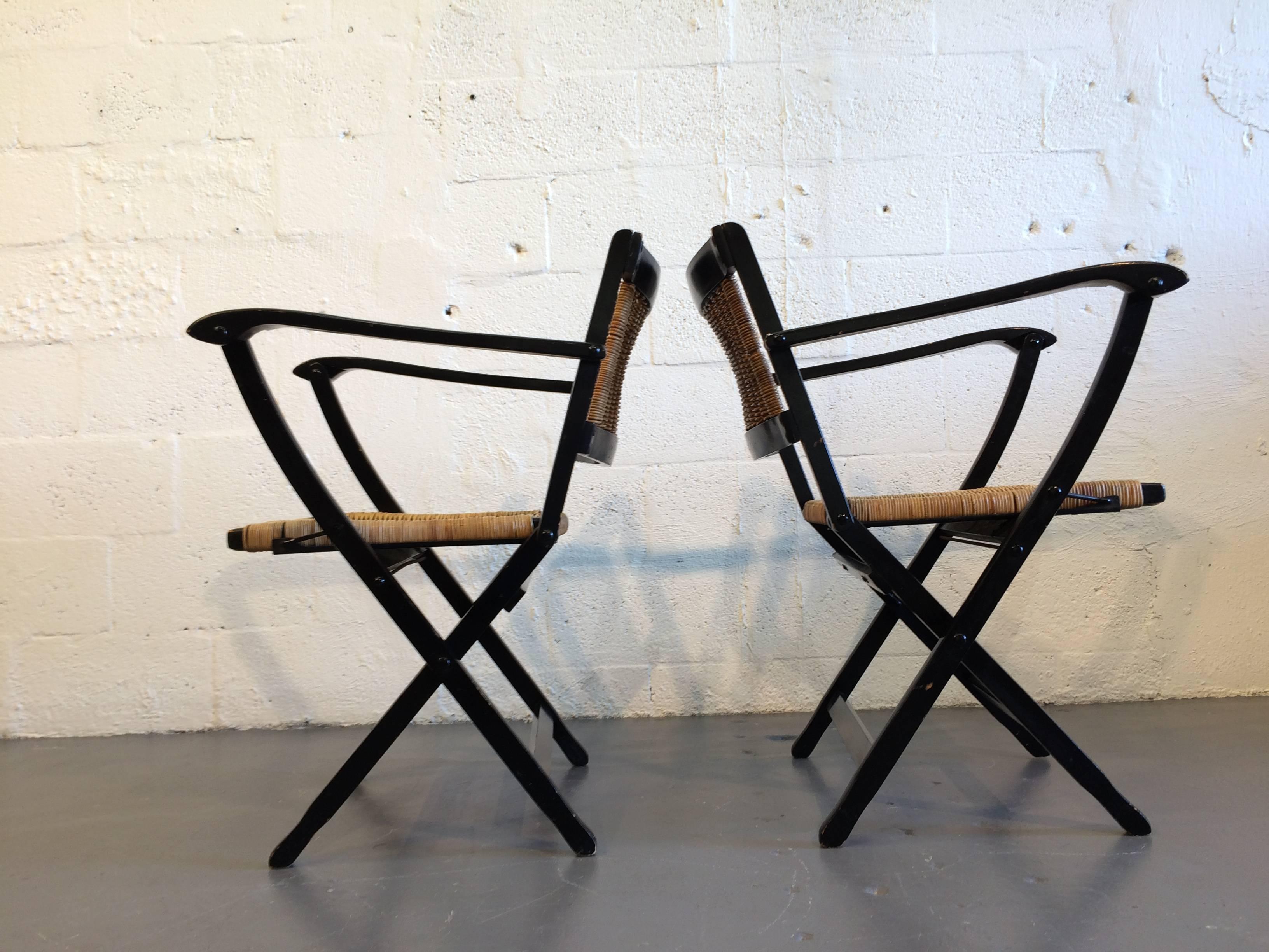 Great set! chairs are foldable. Black painted wood with wicker seat and back.