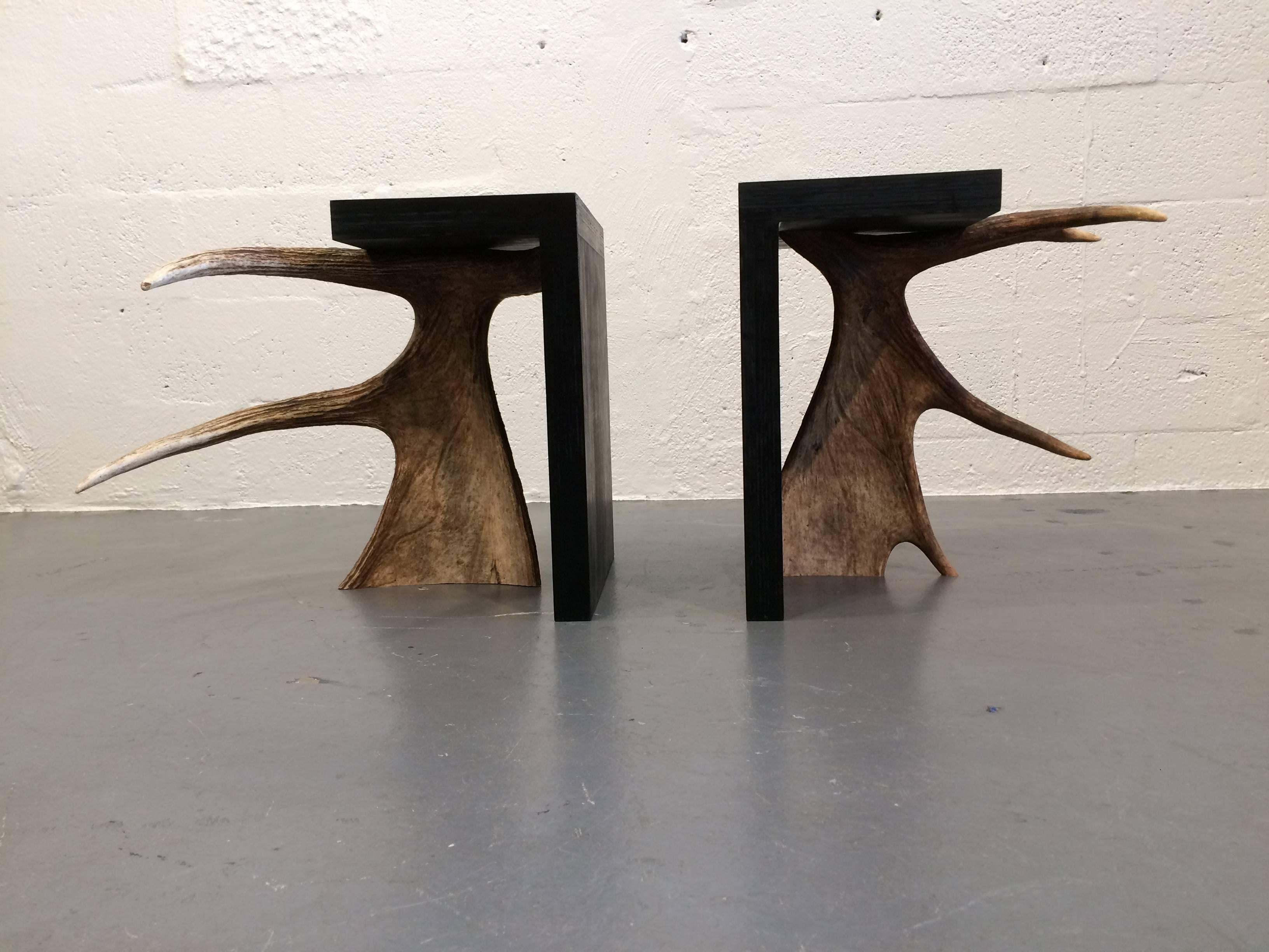 Signed Rick Owens stools or tables in used condition. Black painted plywood with raw Moose antler. Measures: Smaller stool is 15.75