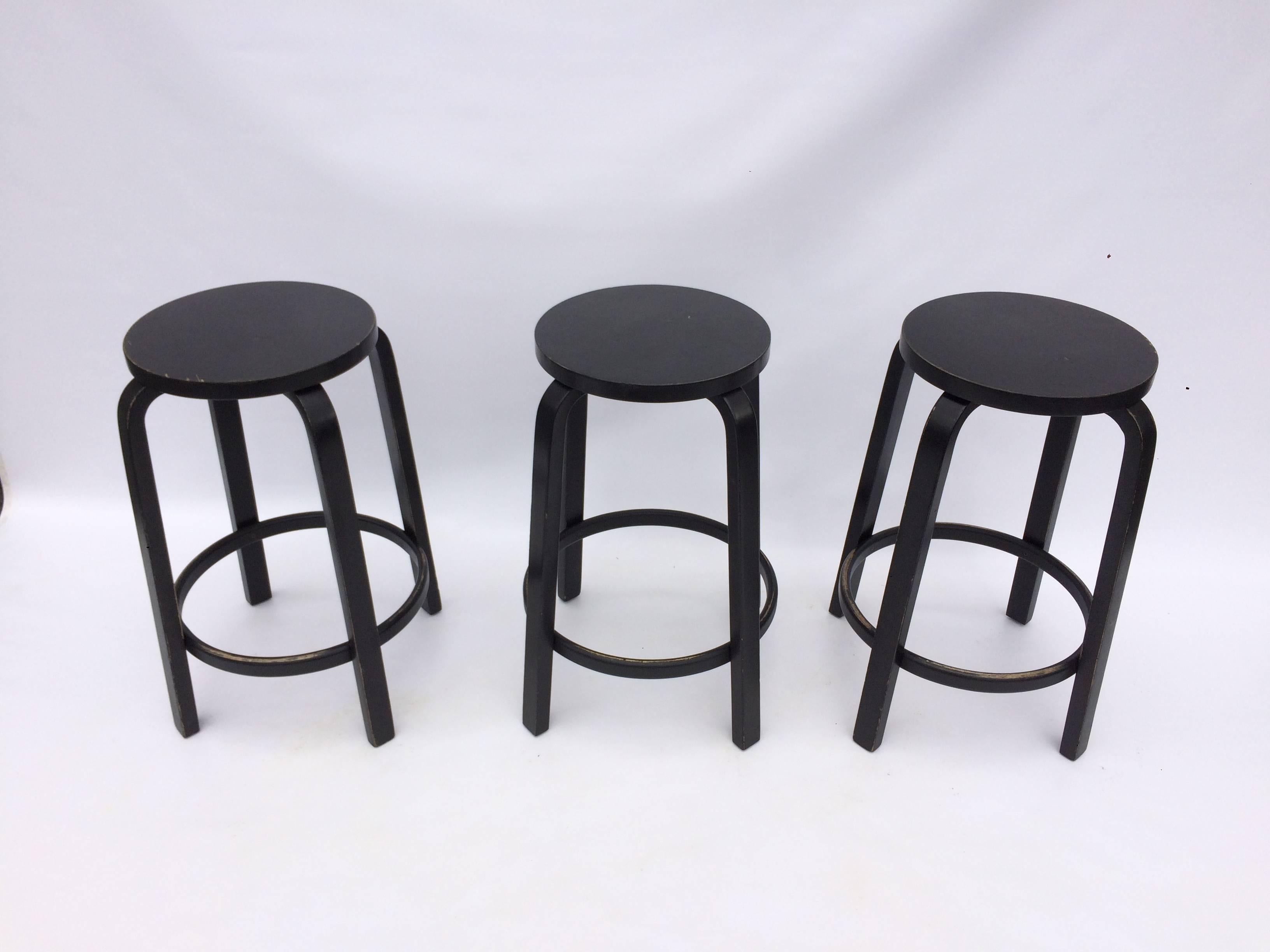 Signed original Aalto stools in black, large quantity available.
For $50 each stools can be painted any color or seats can be covered in fabric. Last three pictures serve as an example.