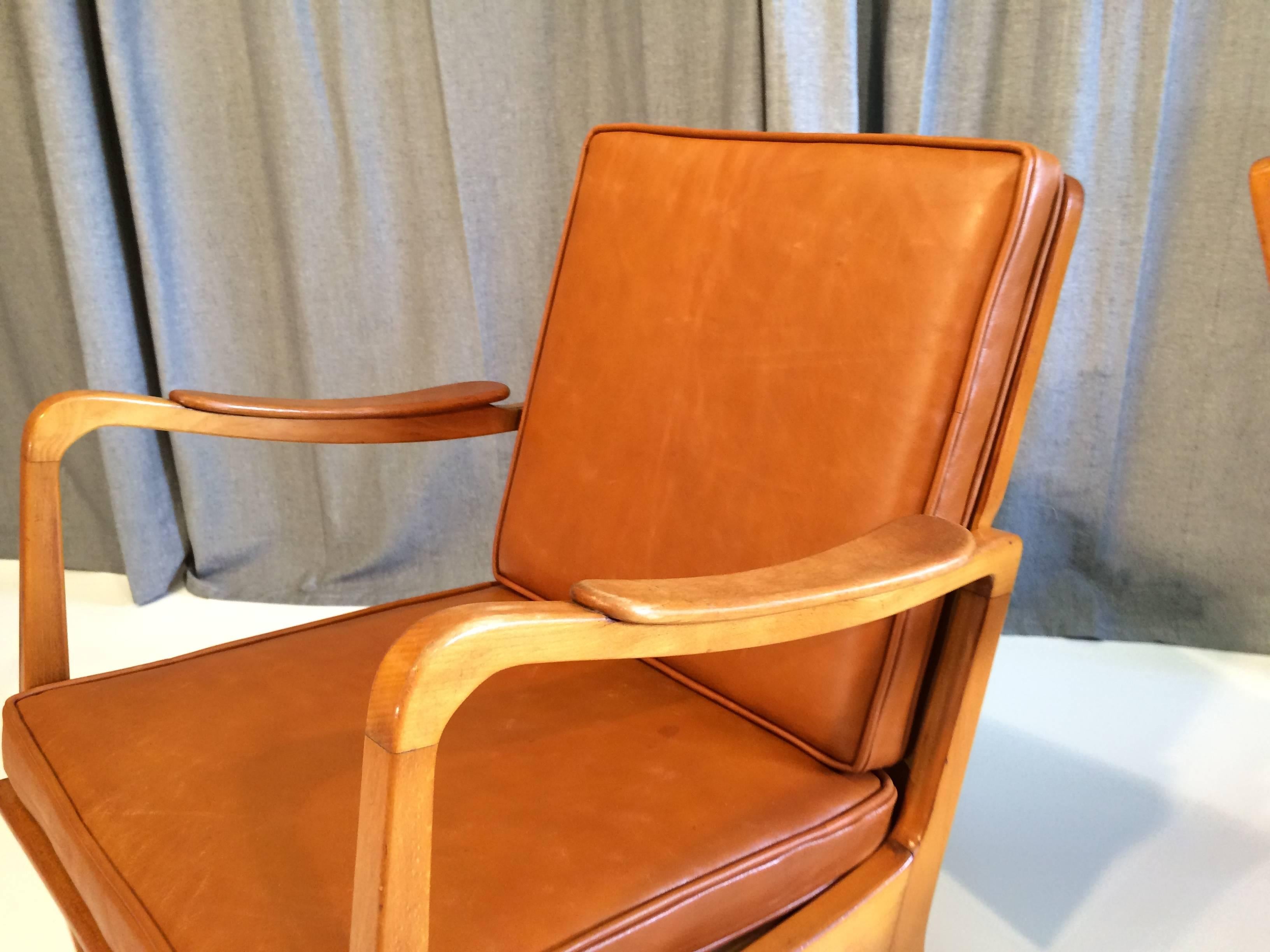 Pair of Danish armchairs made of solid birch, come with nice cognac leather cushions.