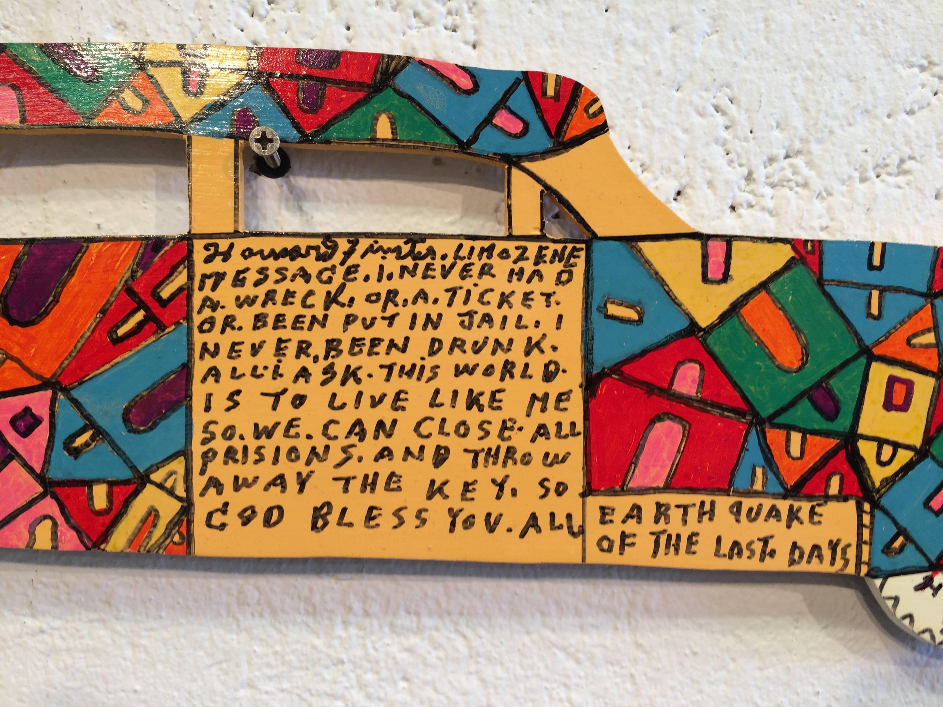 Hand-carved hand-painted wooden sculpture by Artist Howard Finster.