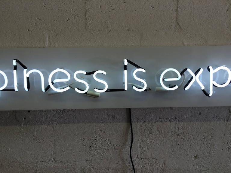 Happiness is Expensive Neon Sign in the Style of Alejandro Diaz at