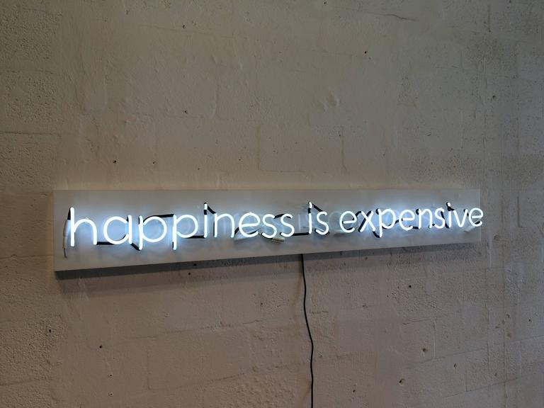 Happiness is Expensive Neon Sign in the Style of Alejandro Diaz at