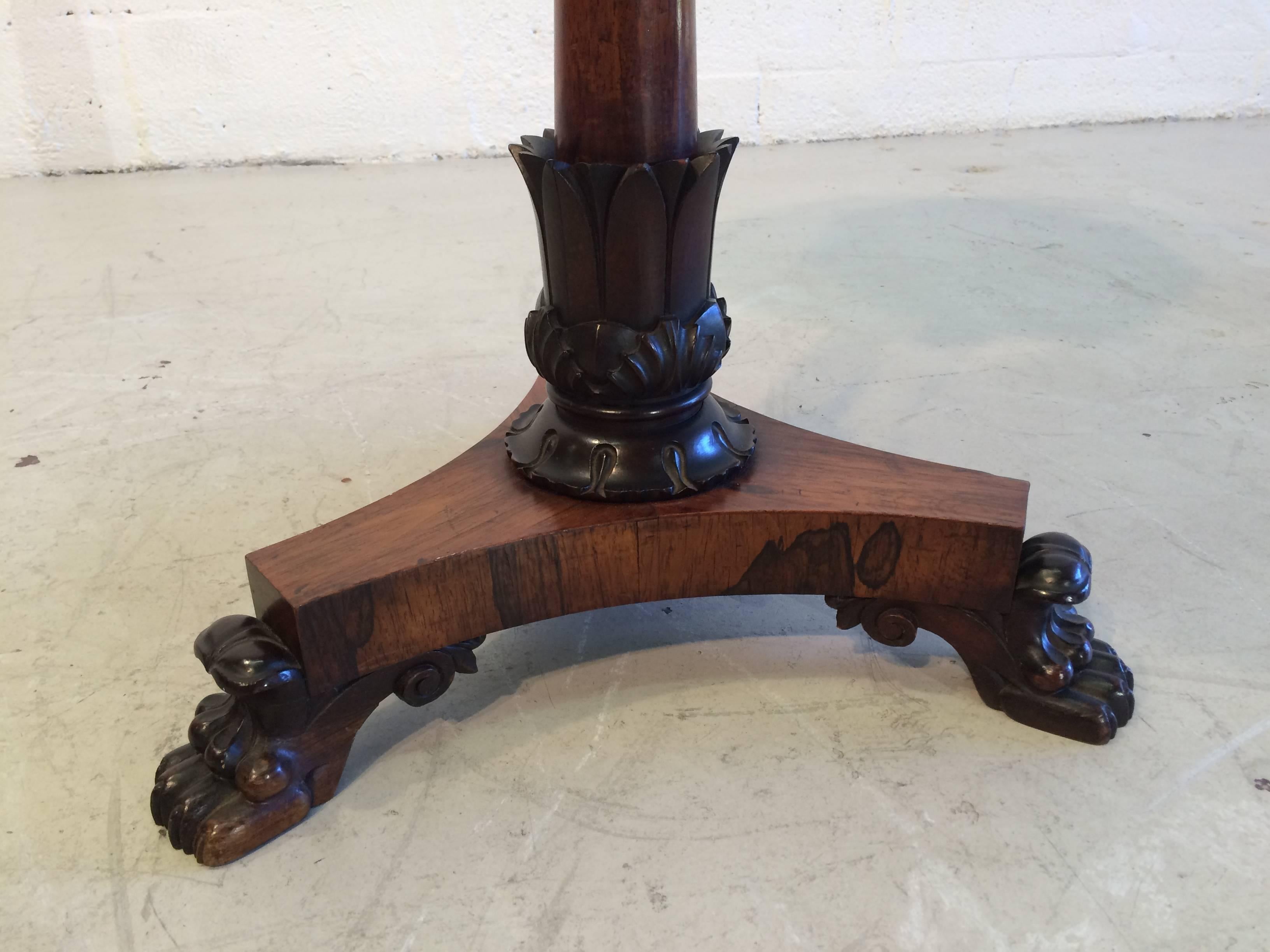 Beautiful antique three-legged side table rosewood claw feet. Please check out all the details.