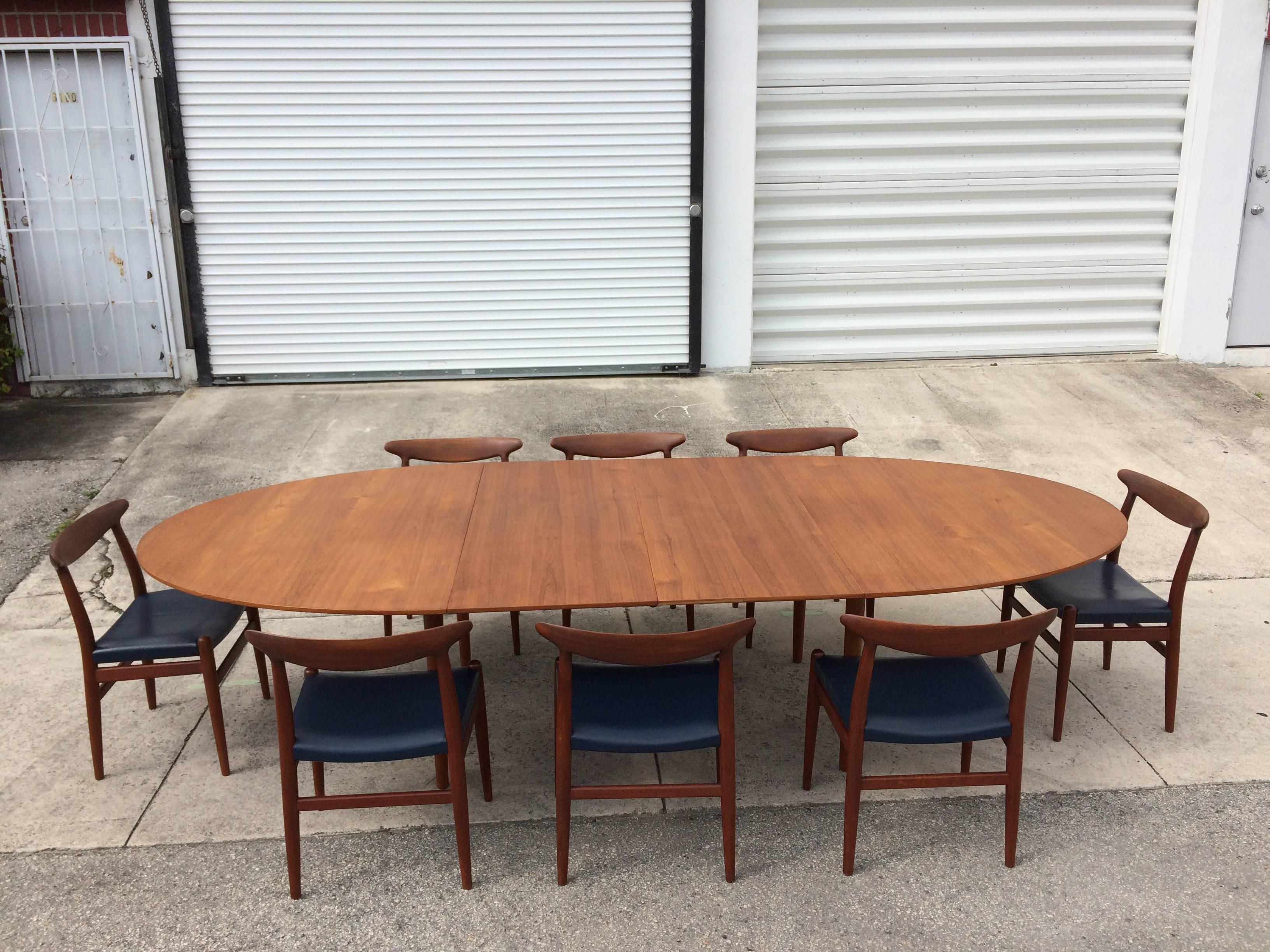 Large Finn Juhl teak dining table.
Table has two 21.75 inch leaves; table measures 122 inches when fully extended, closed without leaves 78.5 W x 55.25 D x 28.5 H inches. The Table is signed, please see pictures.