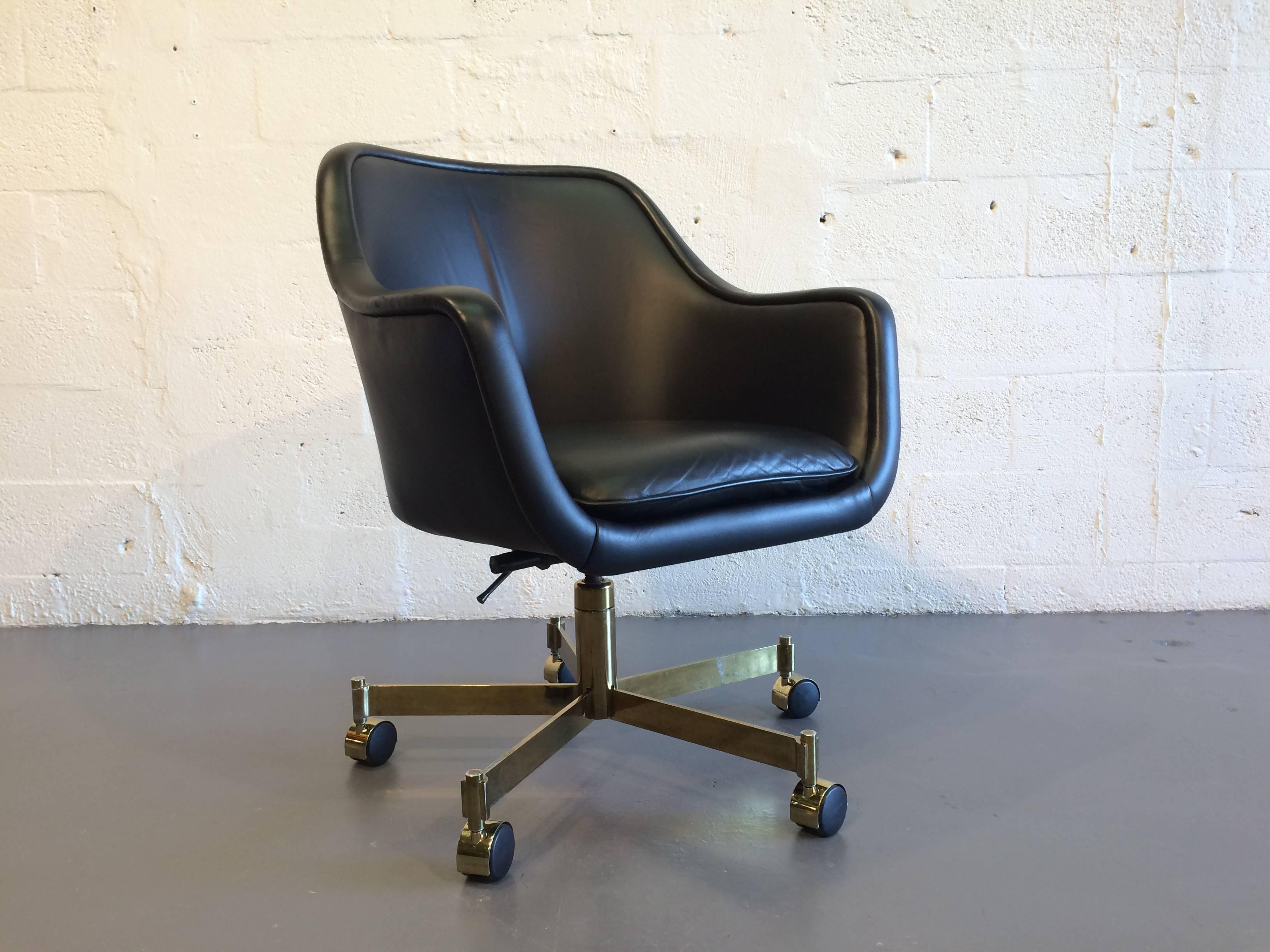 Desk chair by Ward Bennett. The base, tilts, swivels, and has an adjustable height.
