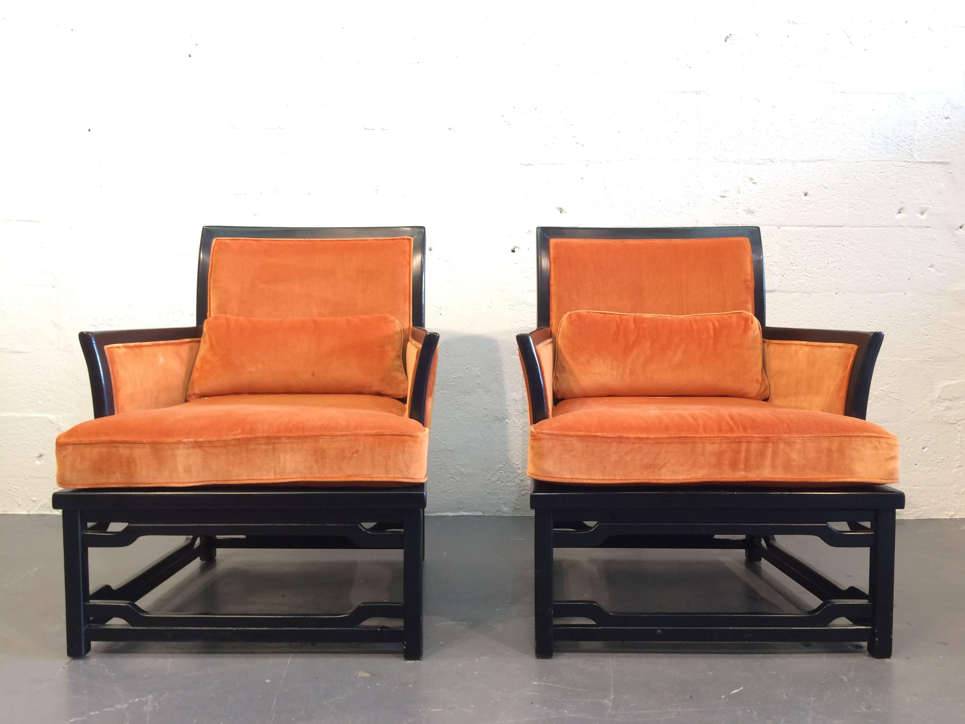 Great pair of lounge chairs in James Mont style.