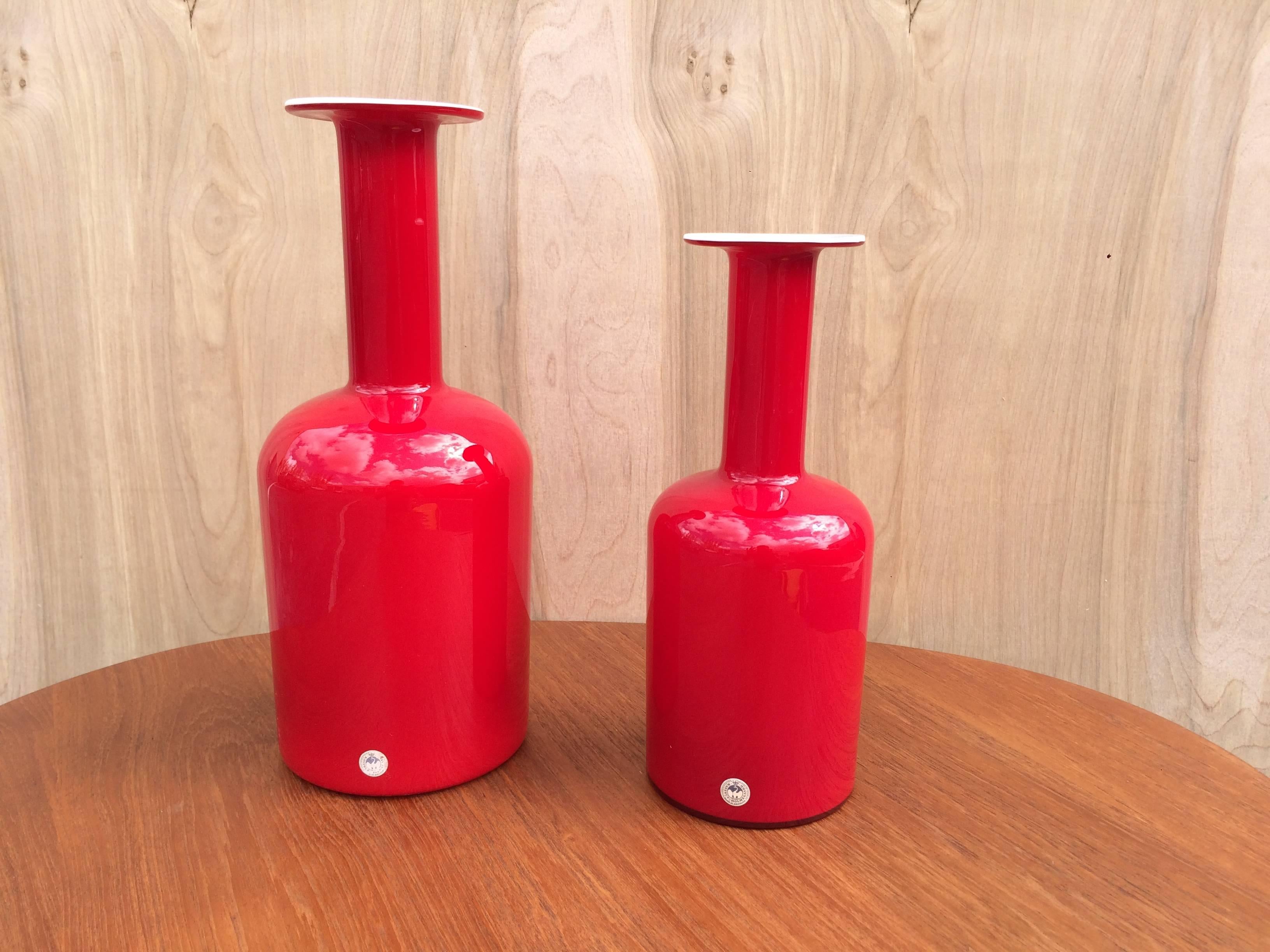 Set of three vases, two red and one green, measure: smaller vase is 12'' high and 4.75