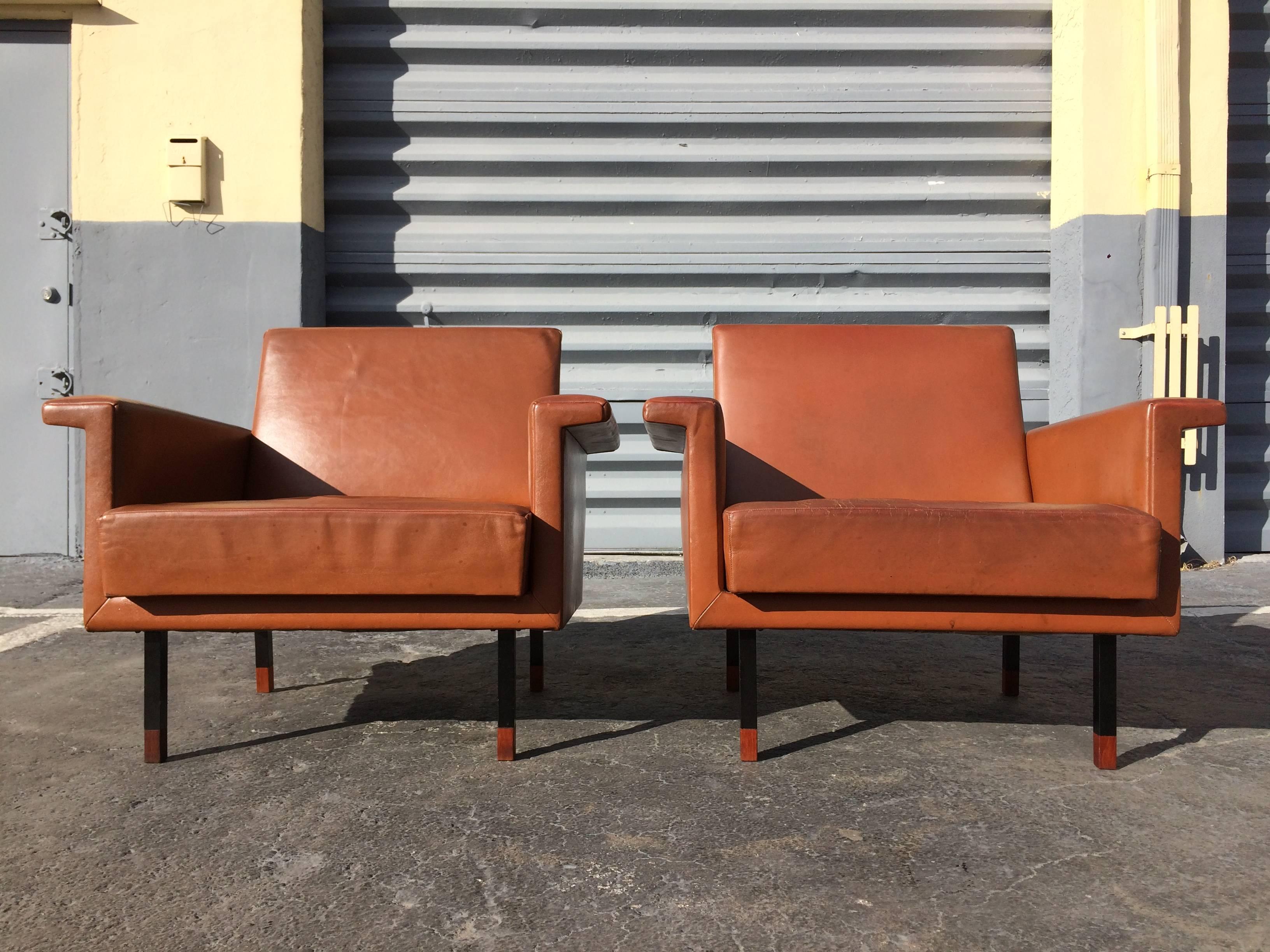 Very rare chairs!
Great form, steel legs with teak tips. Original leather is distressed. One chair has the original ES Soloform label.