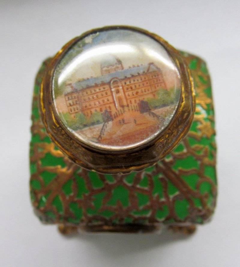 Rare antique French opaline glass and pierced ormolu-mounted scent bottle with miniature paintings within disk on two sides and top.