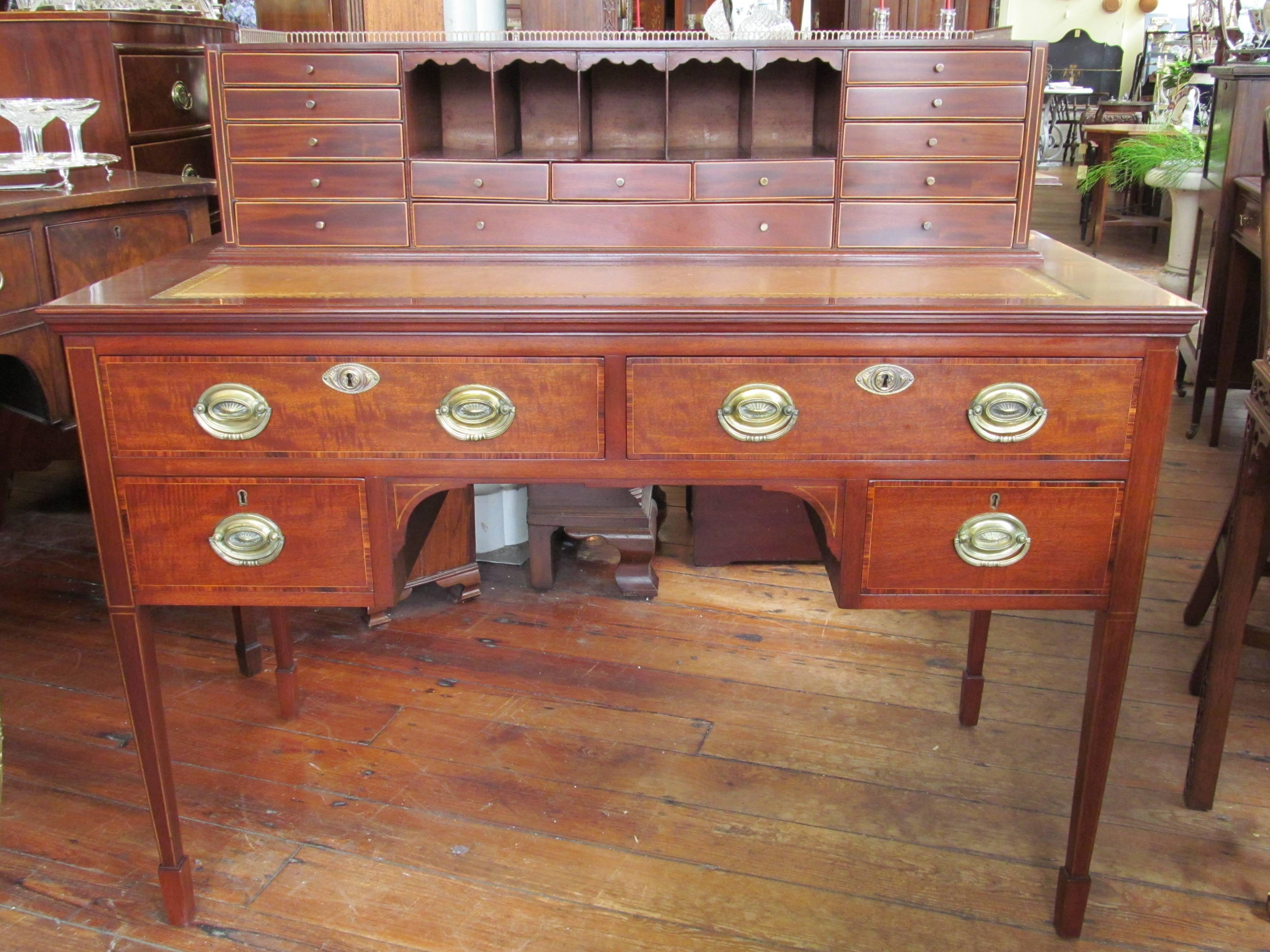 Fabulous quality antique English inlaid mahogany Hepplewhite style writing desk or Carlton House style desk with original oval brasses, and hand tooled and gilded tan leather hide writing surface.  Please note superb and intricately hand-dovetailed