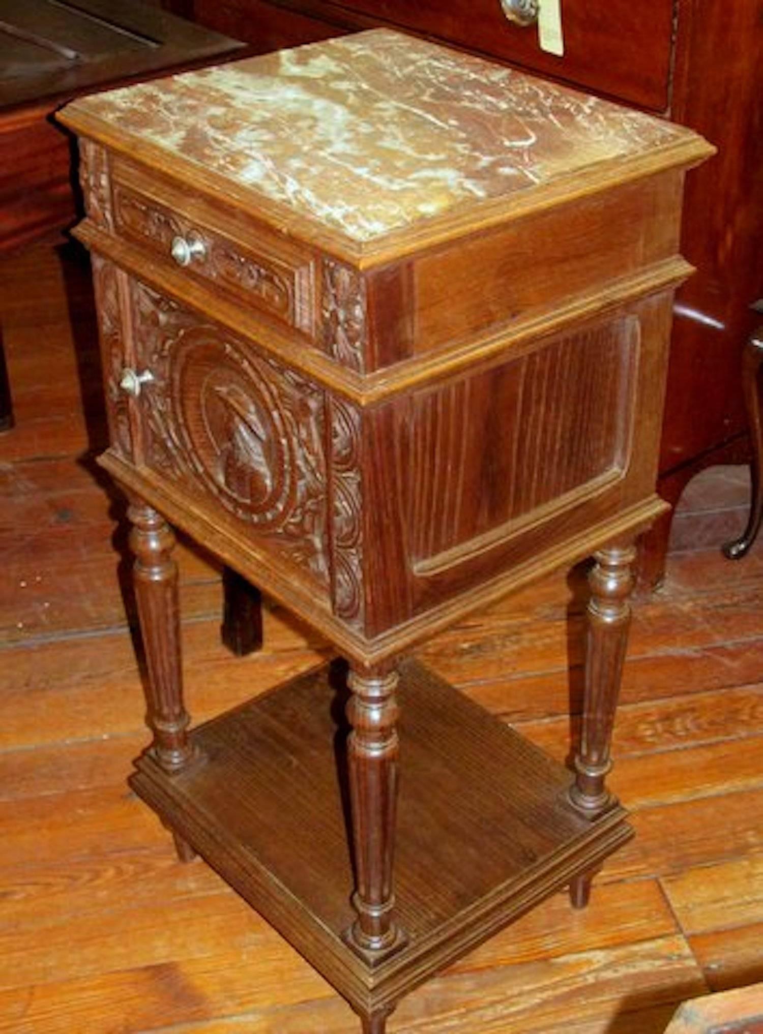 Fabulous hand-carved old French oak marble-top pot cupboard. Please note exceptional hand-carved door, in the Breton style. Marble is original and in perfect condition.